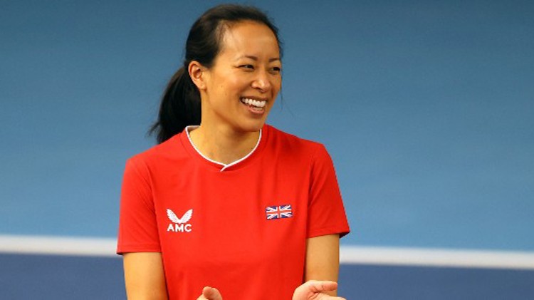 Anne Keothavong smiling for a picture and clapping