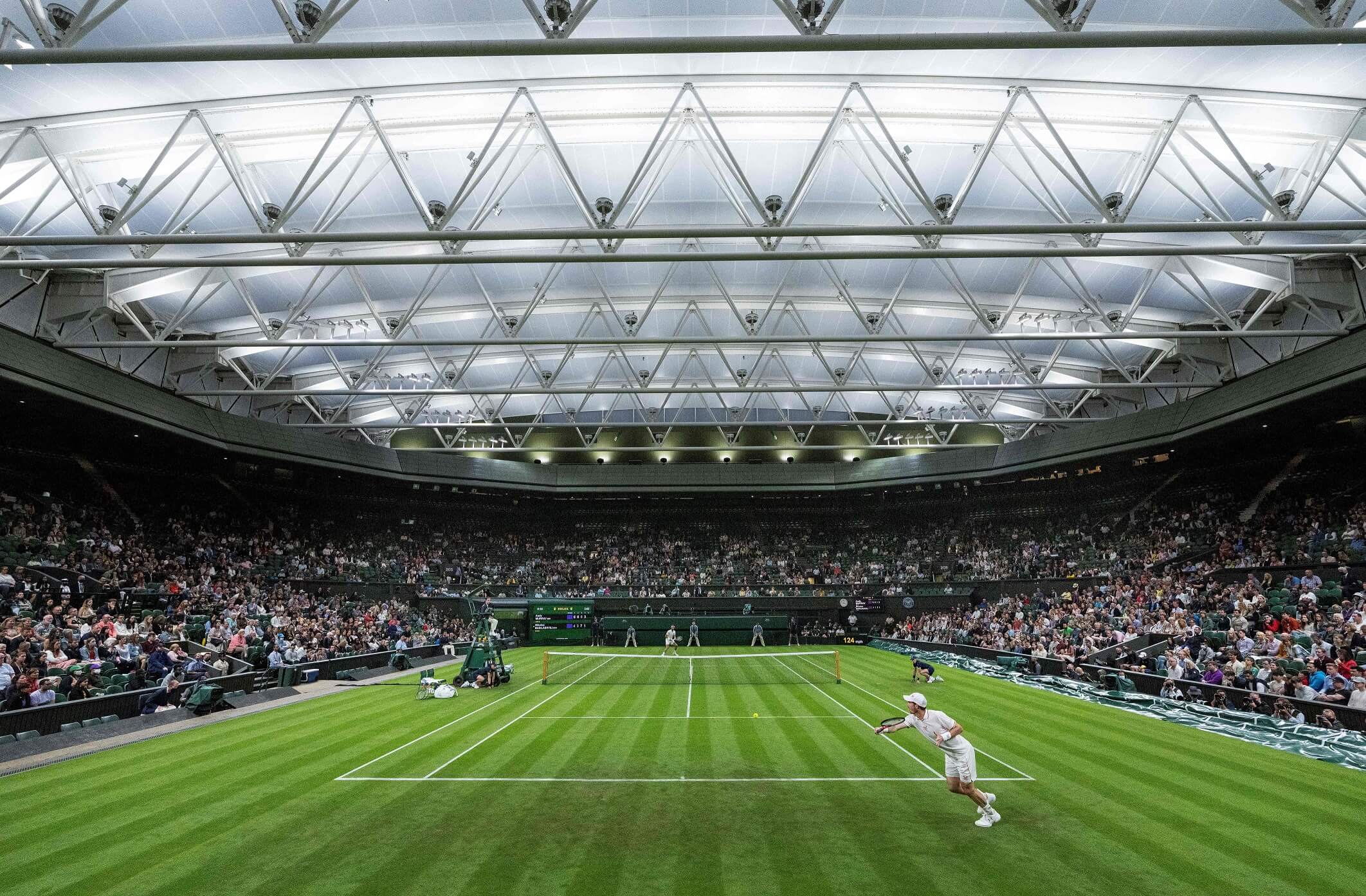 Andy Murray plays against Nikoloz Basilashvili in their men's singles first round match of the 2021 Wimbledon Championships 