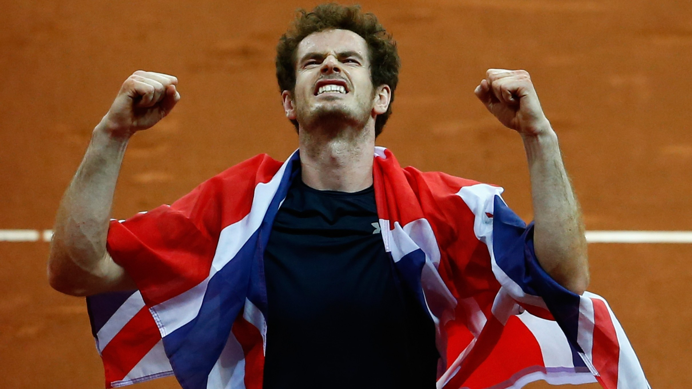 Andy Murray of Great Britain celebrates winning his singles match against David Goffin of Belgium and clinching the Davis Cup