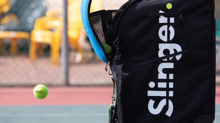 Close up of a Slinger bag on a tennis court