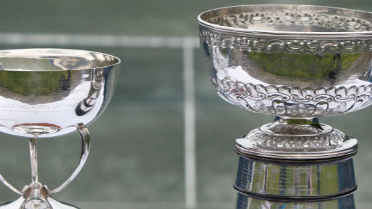 Two silver trophies photographed in front of a tennis court on  for the scottish cup finals at newlands tennis club