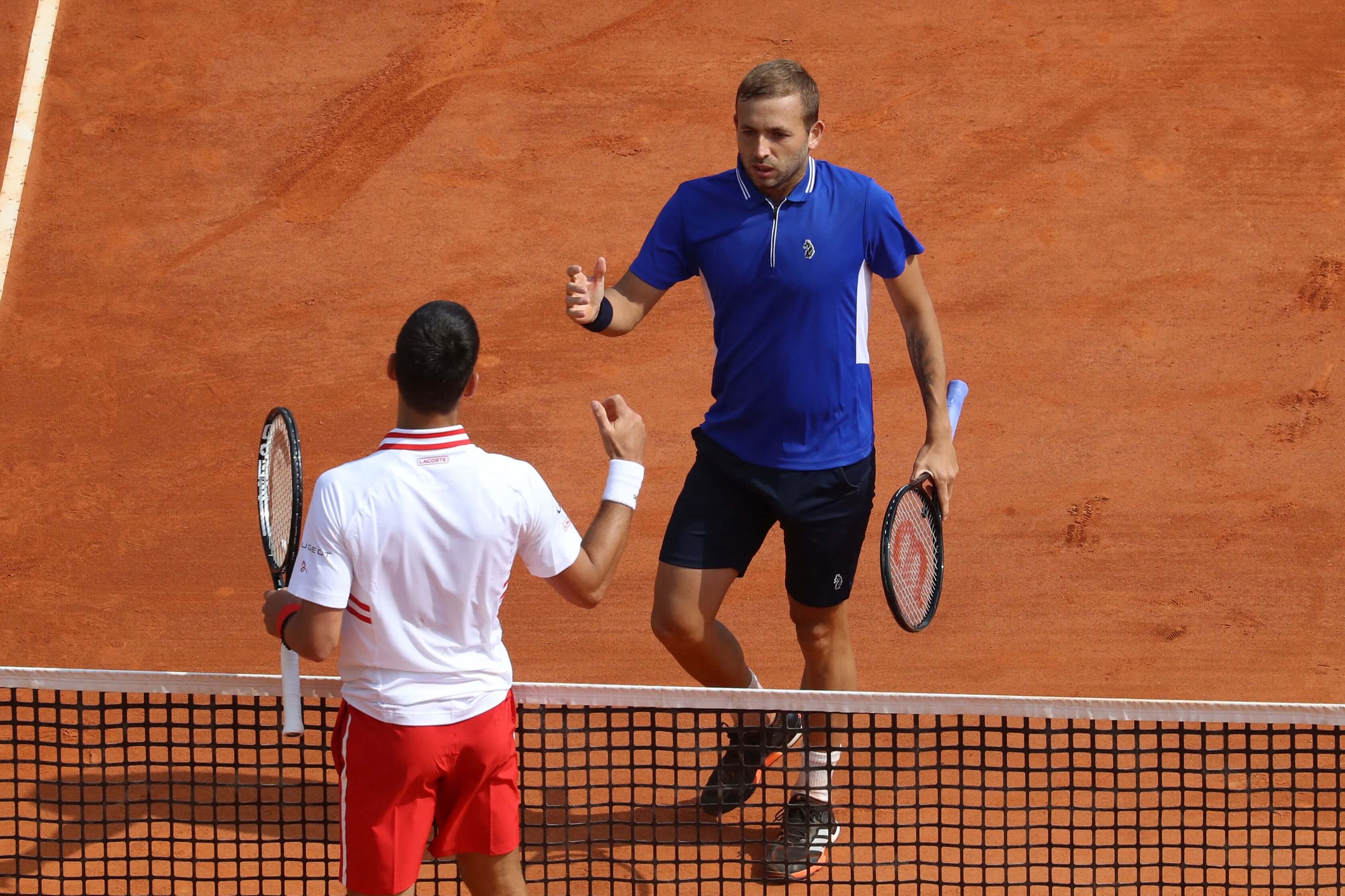 Dan Evans and Novak Djokovic.jpg