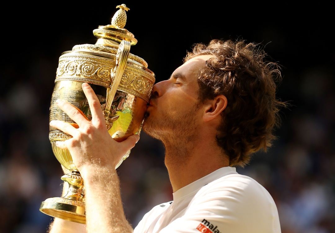 Andy Murray kisses the trophy after being crowned Wimbledon champion for the second time in his career