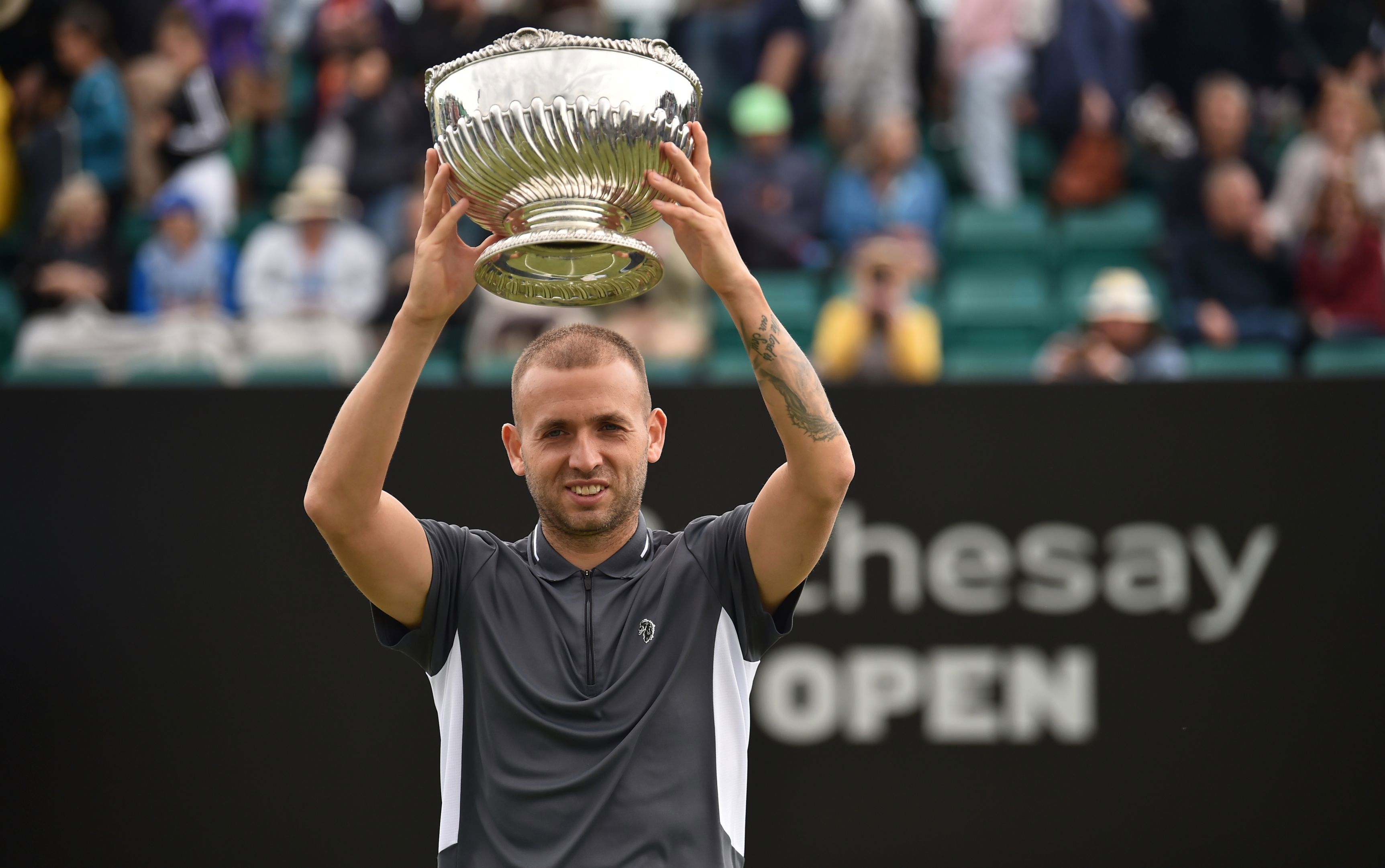 Dan Evans lifting a trophy at Rothesay open championship