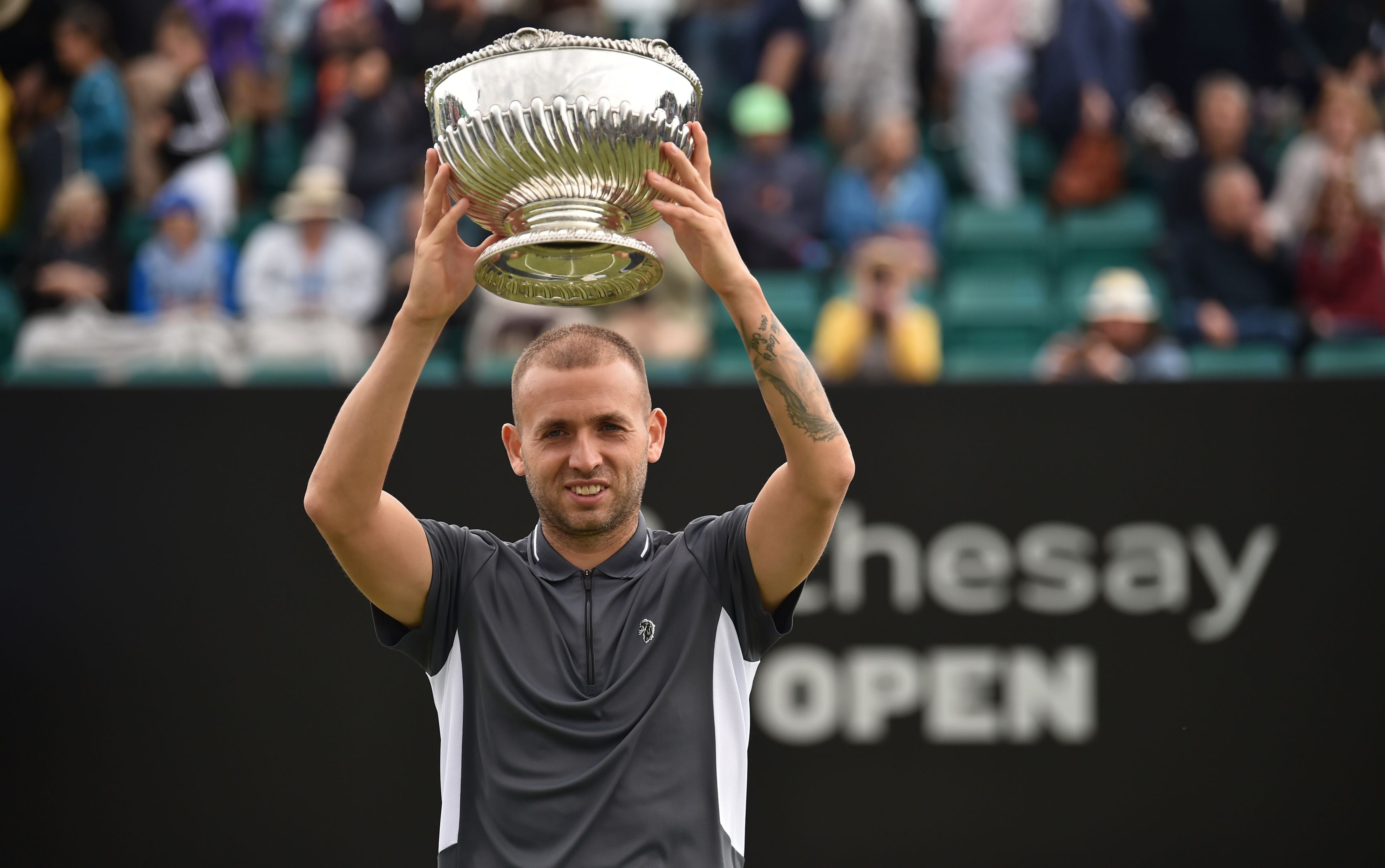 Dan Evans lifting a trophy at Rothesay open championship