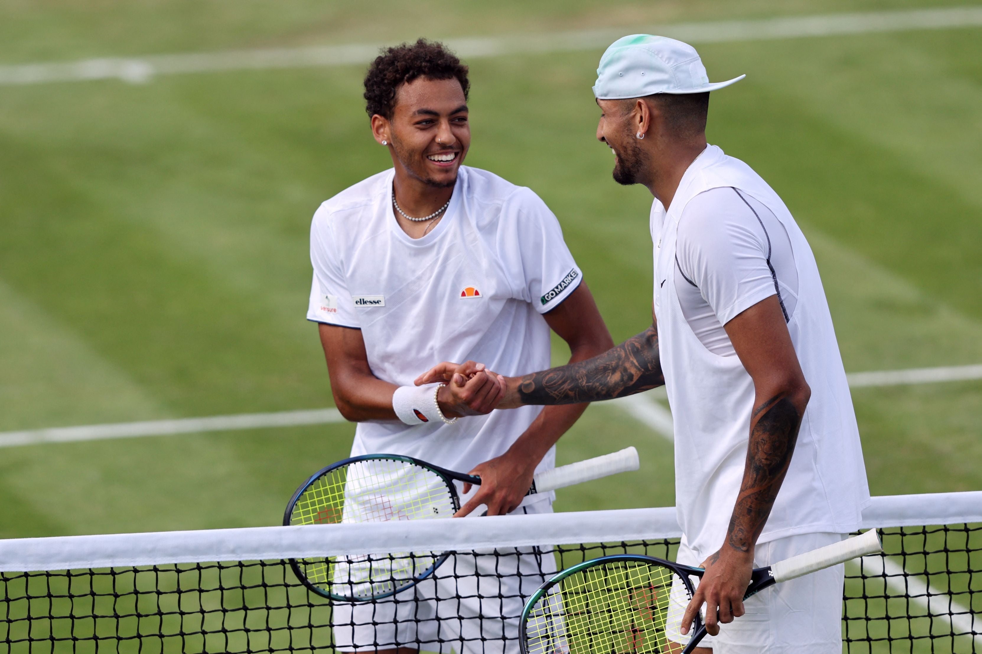 Paul Jubb shakes hands with Nick Kyrgios at Wimbledon