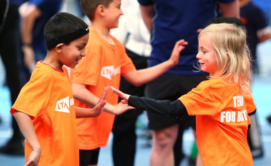 SERVES kids high fiving on court