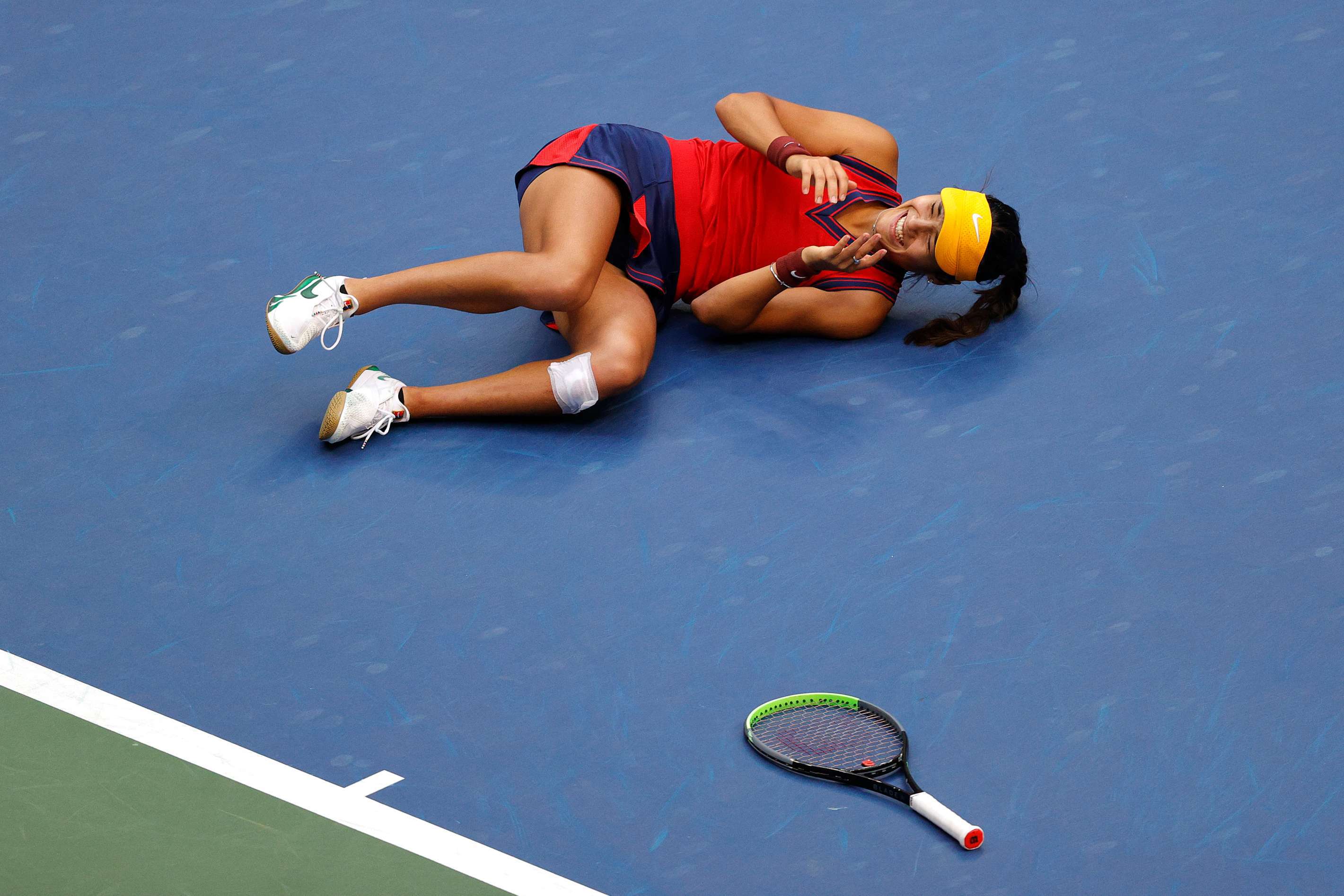 Emma Raducanu collapses in celebration in the US Open final
