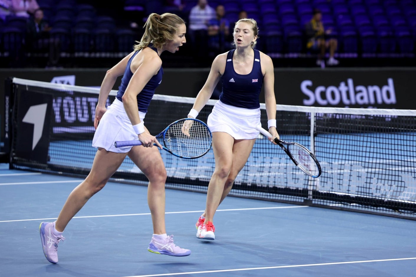 Olivia Nicholls and Alicia Barnett celebrating during their doubles rubber against Kazakhstan at the 2022 Billie Jean King Cup