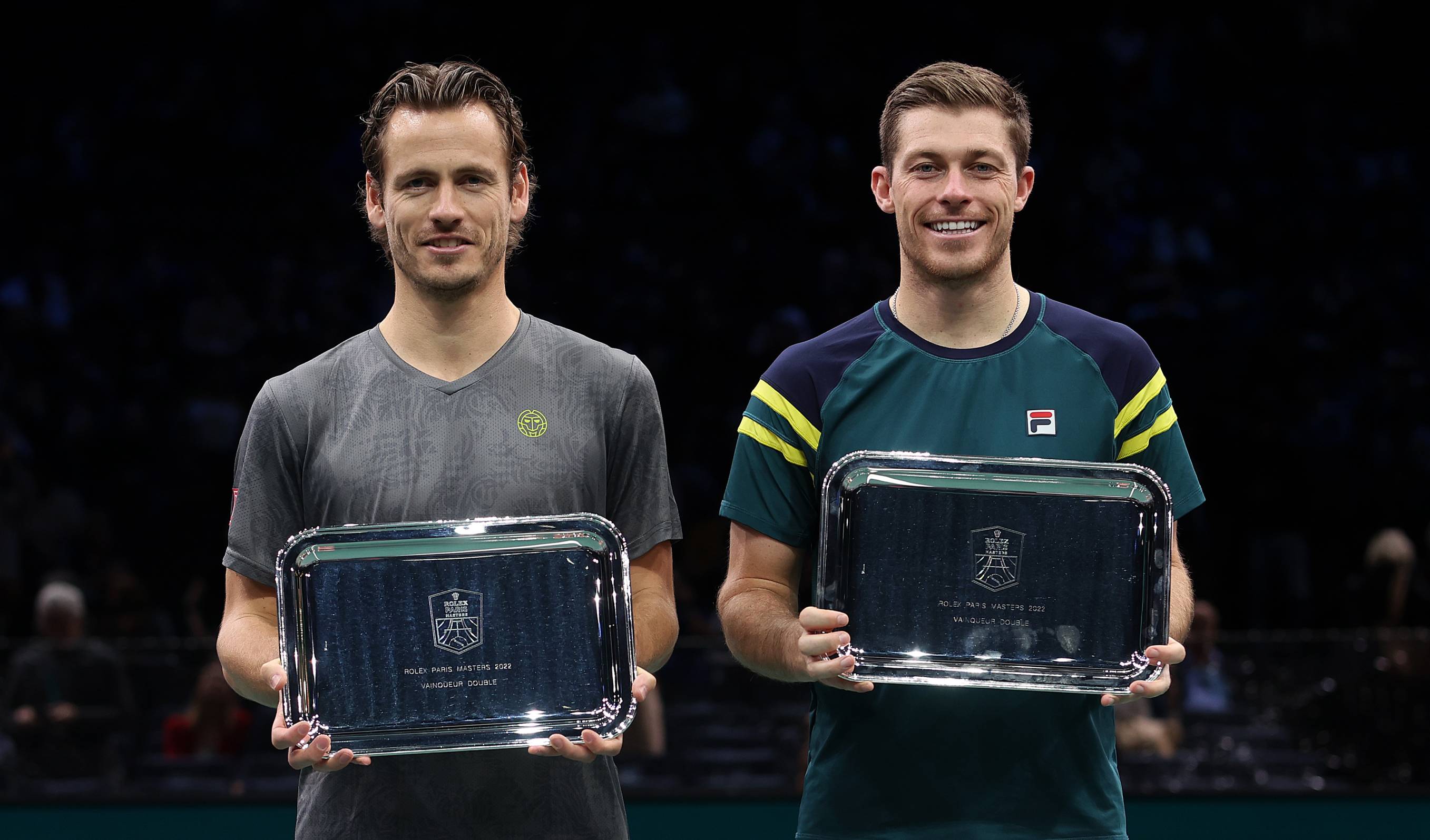 Neal Skupski and Wesley Koolhof holding the Rolex Paris Masters doubles trophy