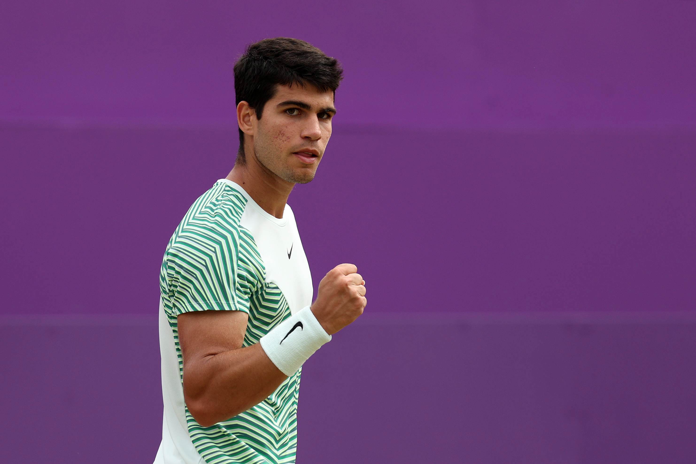 Carlos Alcaraz clenching his fist in celebration after winning his semi-final match against Sebastian Korda
