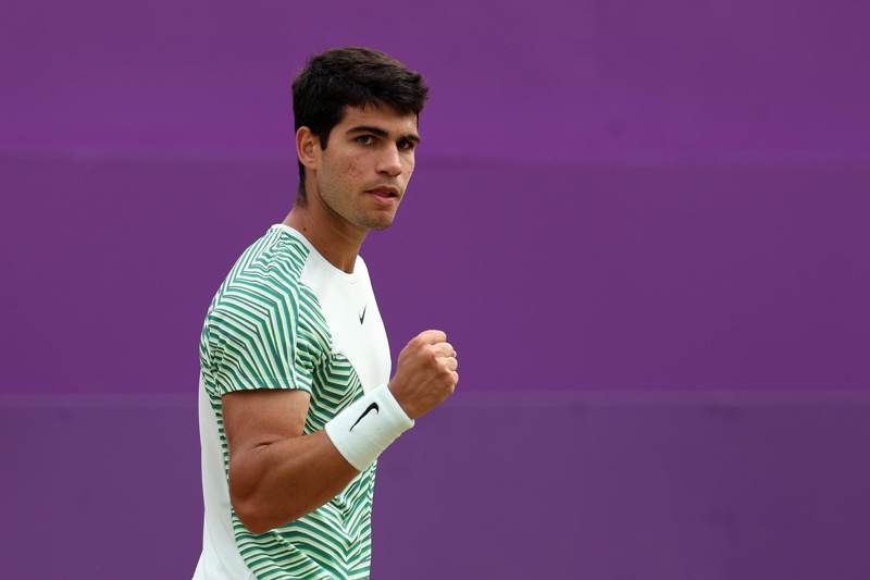Carlos Alcaraz clenching his fist in celebration after winning his semi-final match against Sebastian Korda