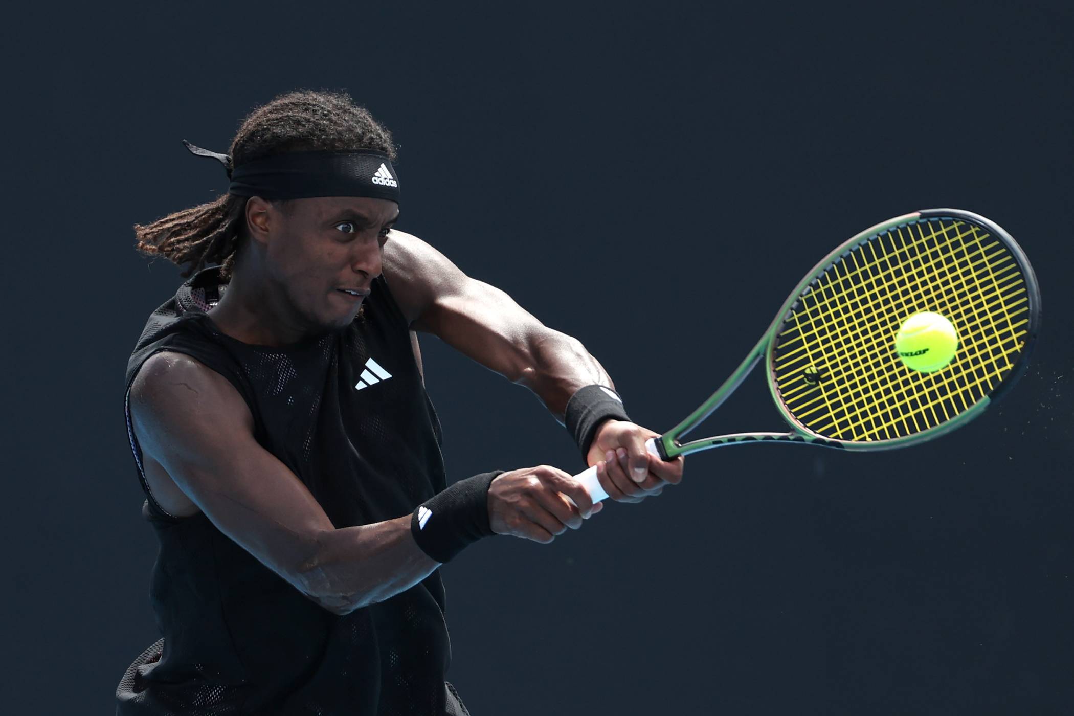 Mikael Ymer hitting a backhand at the Australian Open 