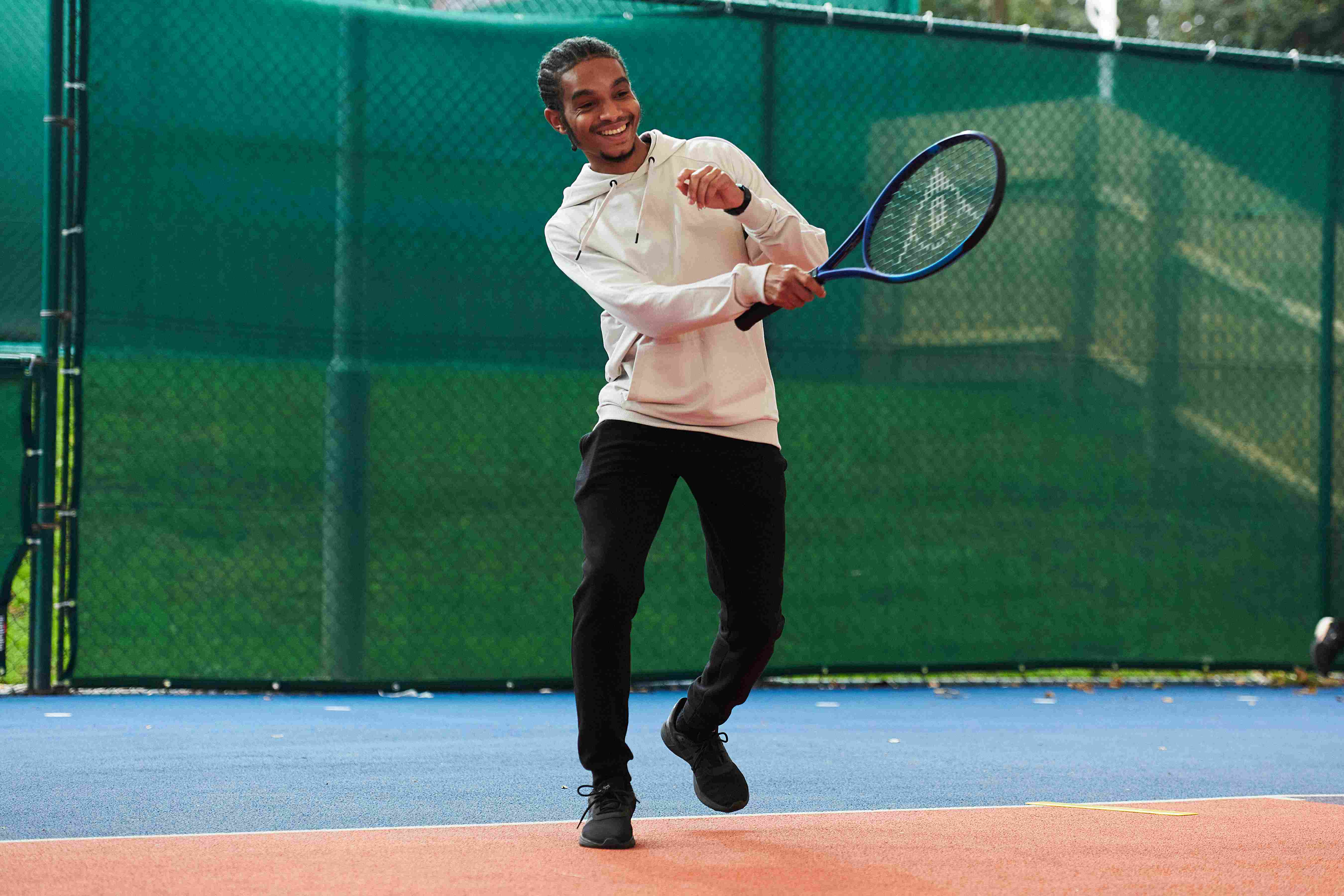 A male tennis player on court at the National Tennis Centre for the Tennis Black List event
