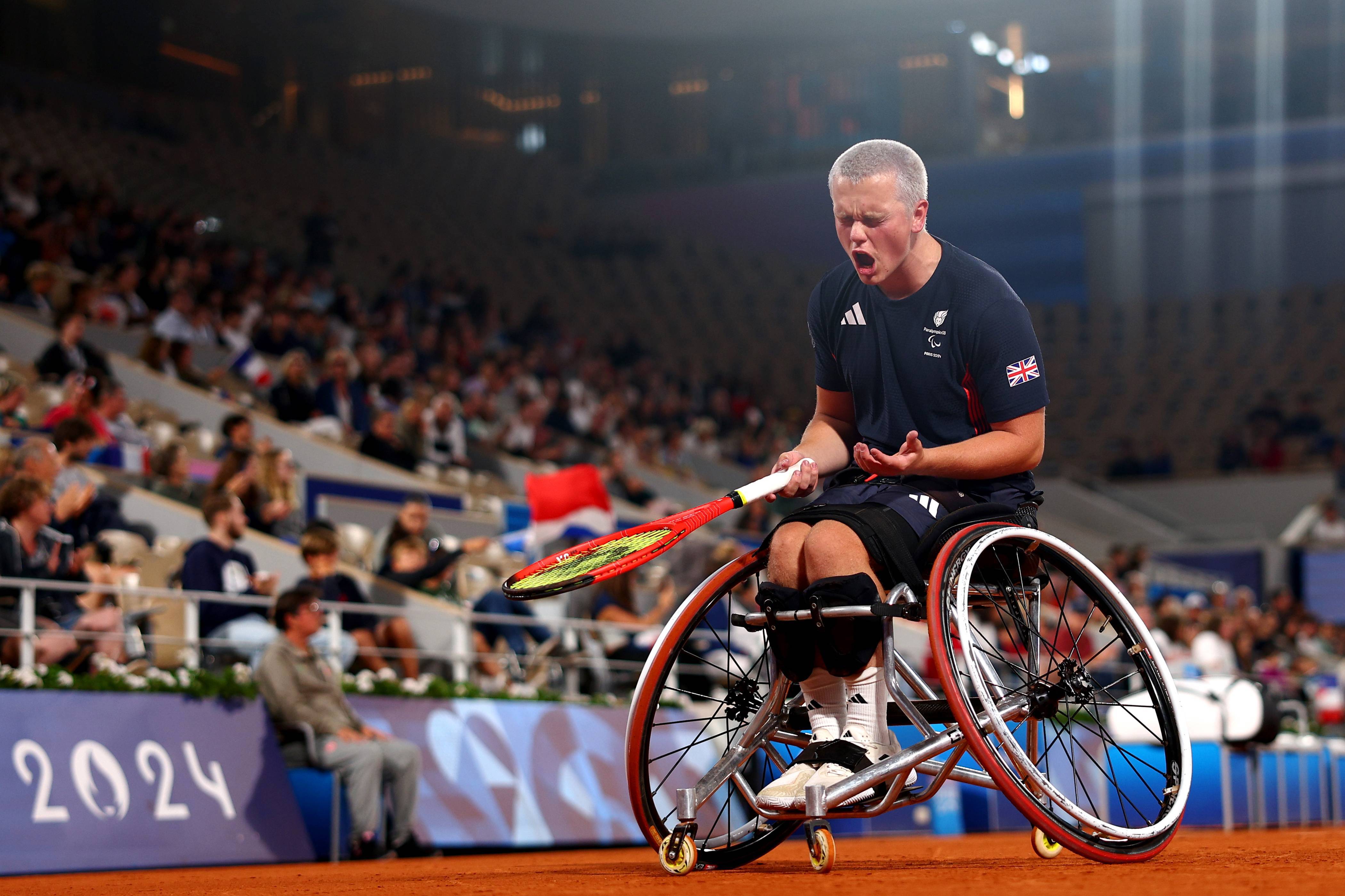 Ben Bartram of Team Great Britain or Paralympics GB celebrates a point as he compete against Guilhem Laget of Team France during their Men's Singles First Round match on day two of the Paris 2024 Summer Paralympic Games at Roland Garros on August 30, 2024 in Paris, France. 