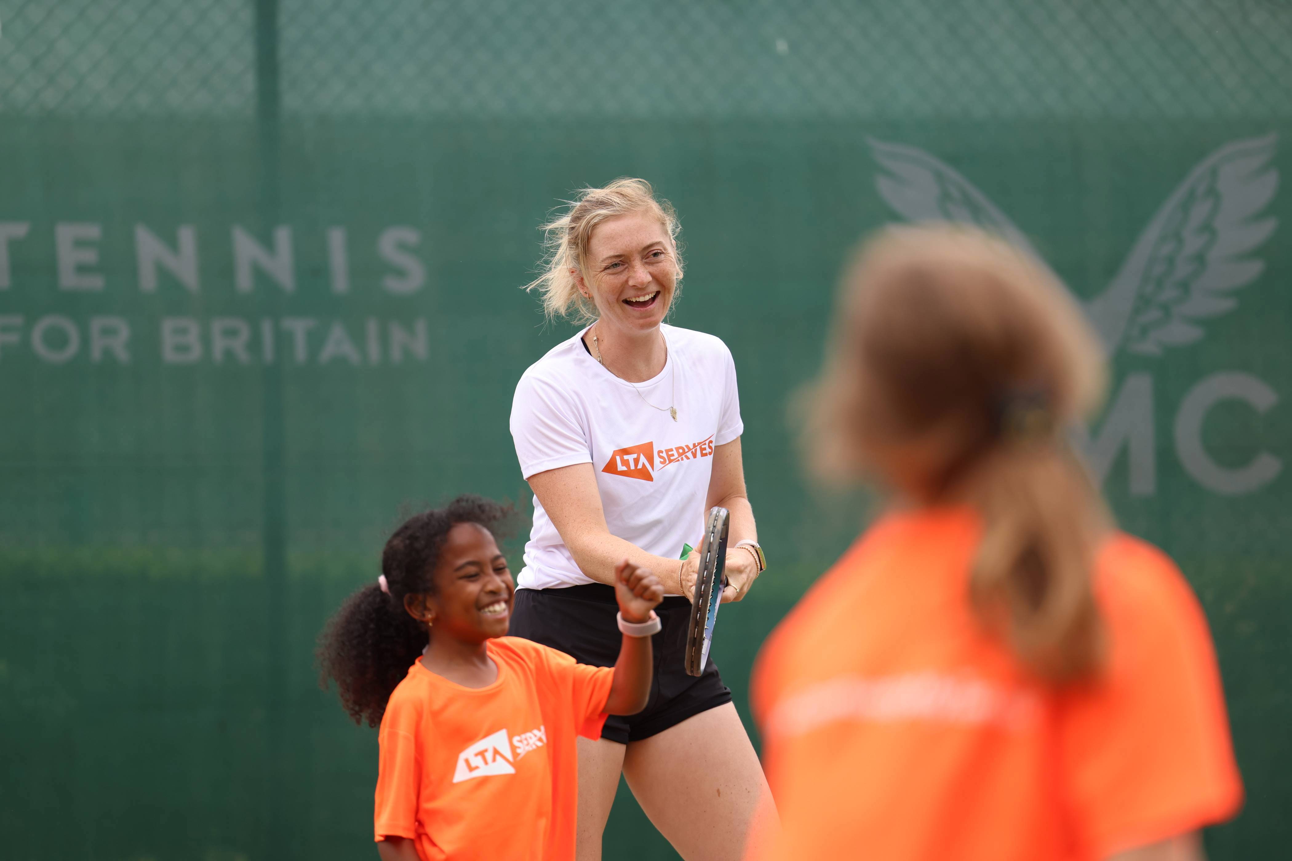 Alicia Barnett laughs while playing at an LTA SERVES event