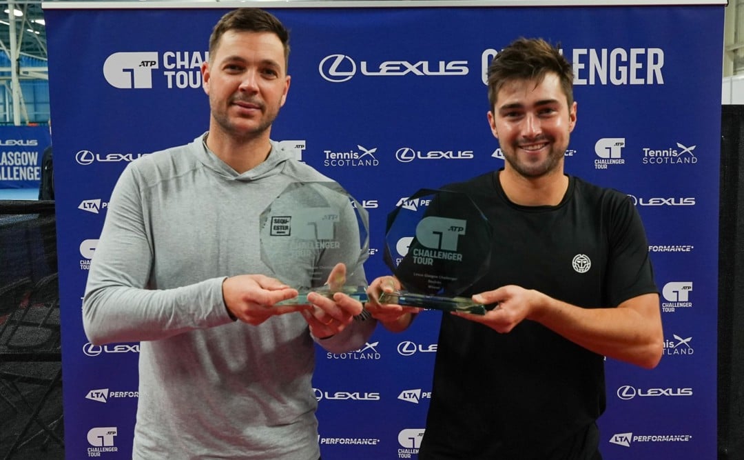 Scott Duncan and Marcus Willis holding their doubles trophies after winning the Lexus Glasgow Challenger