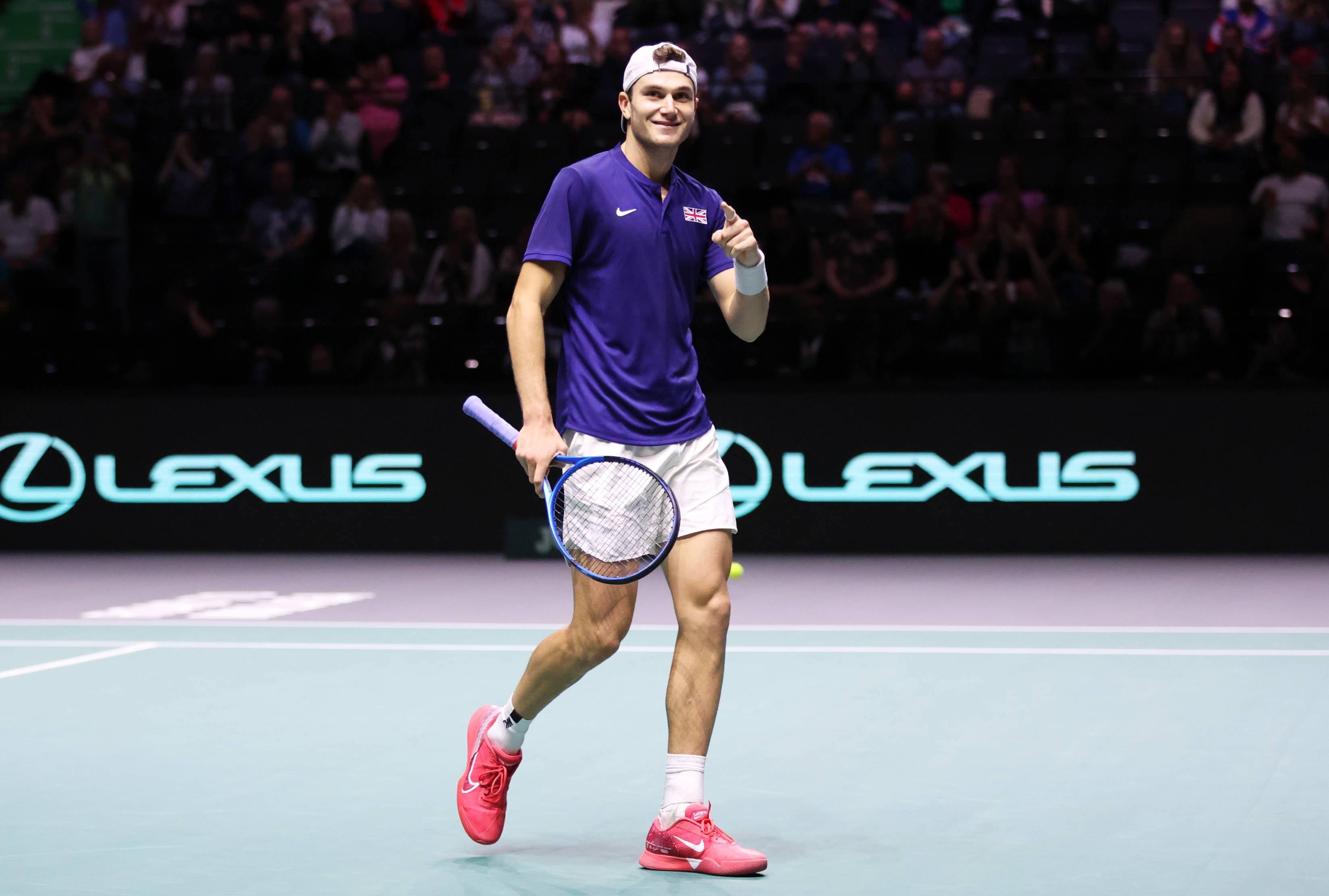 Jack Draper points to the crowd after winning his first Davis Cup match in Manchester