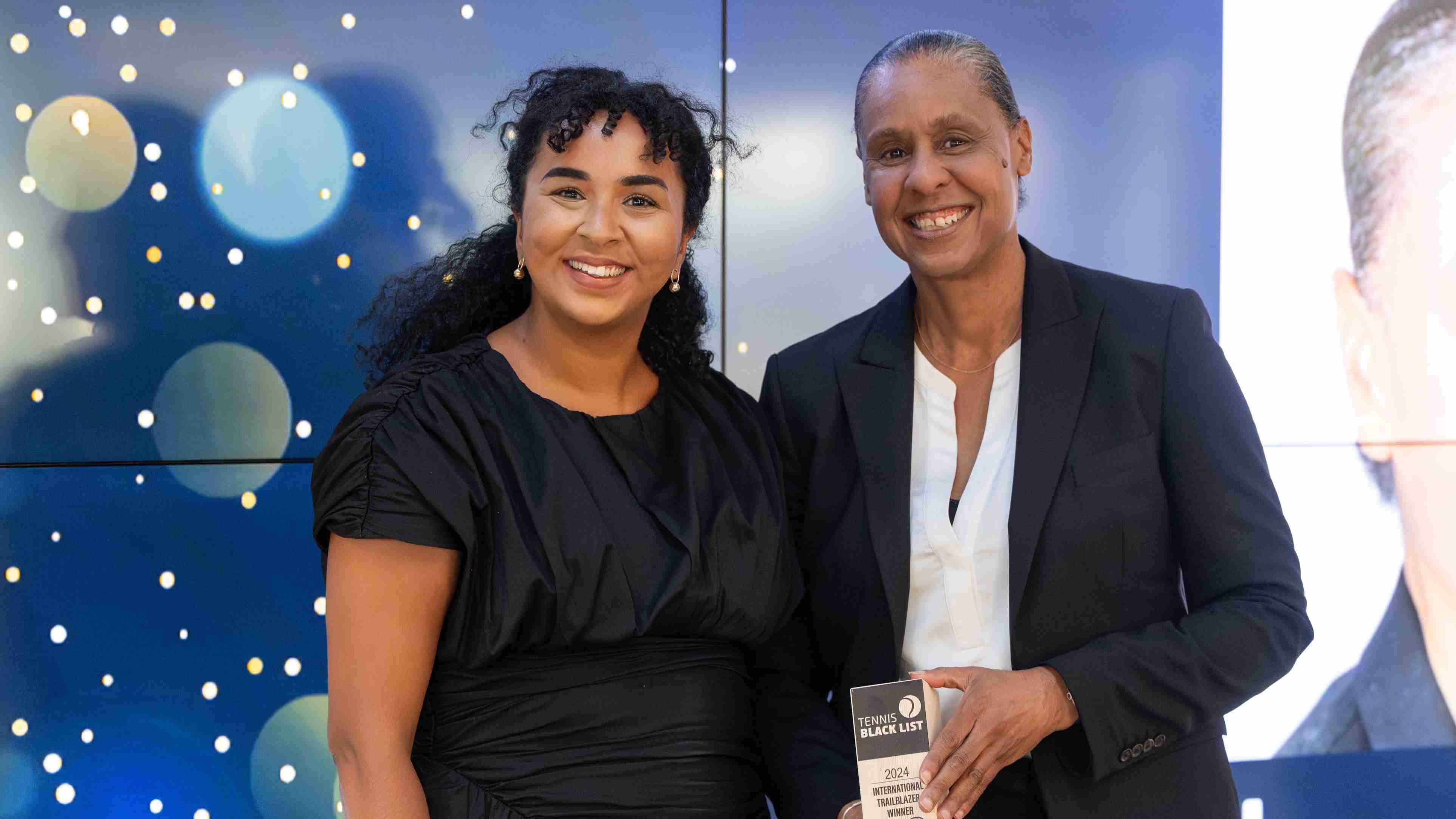 Two of the International Trailblazer Winners at the Tennis Black List smiling while holding their awards