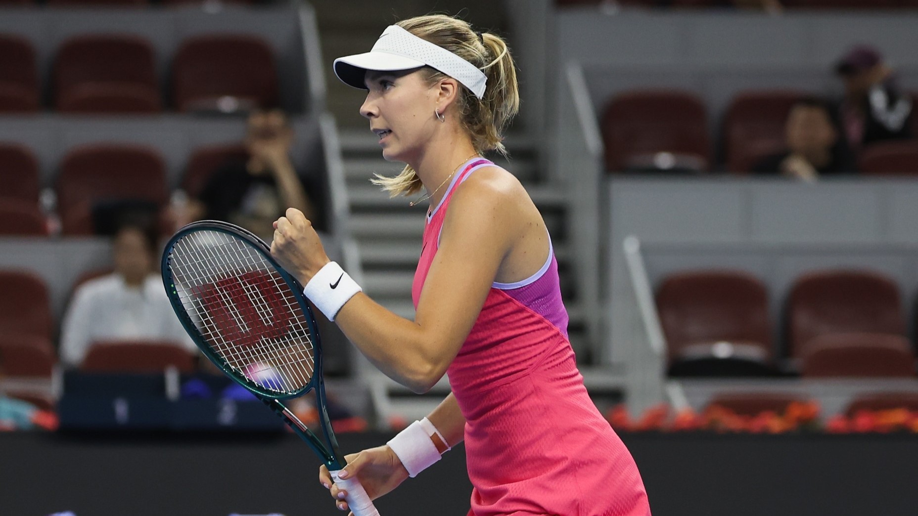 Katie Boulter competing at the WTA 1000 China Open while clenching her fist