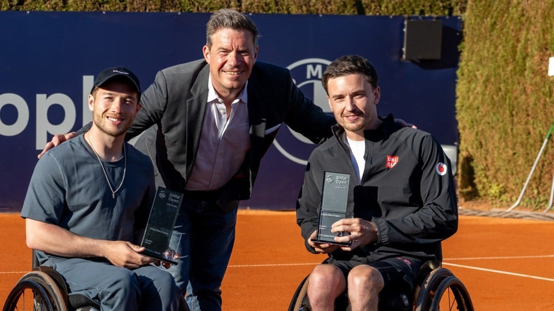 Alfie Hewett and Gordon Reid holding the ITF1S Munich men's doubles title