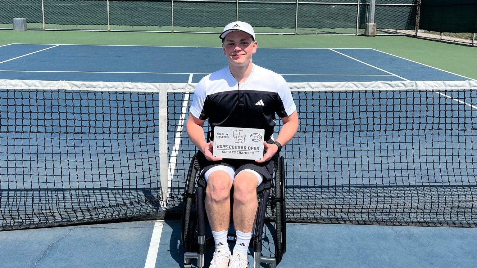 Ben Bartram holding the 2025 men's wheelchair singles title at the Cougar Open 