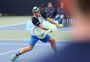 Ben Gusic Wan hitting a volley at the 2025 Lexus Junior National Championships at the National Tennis Centre