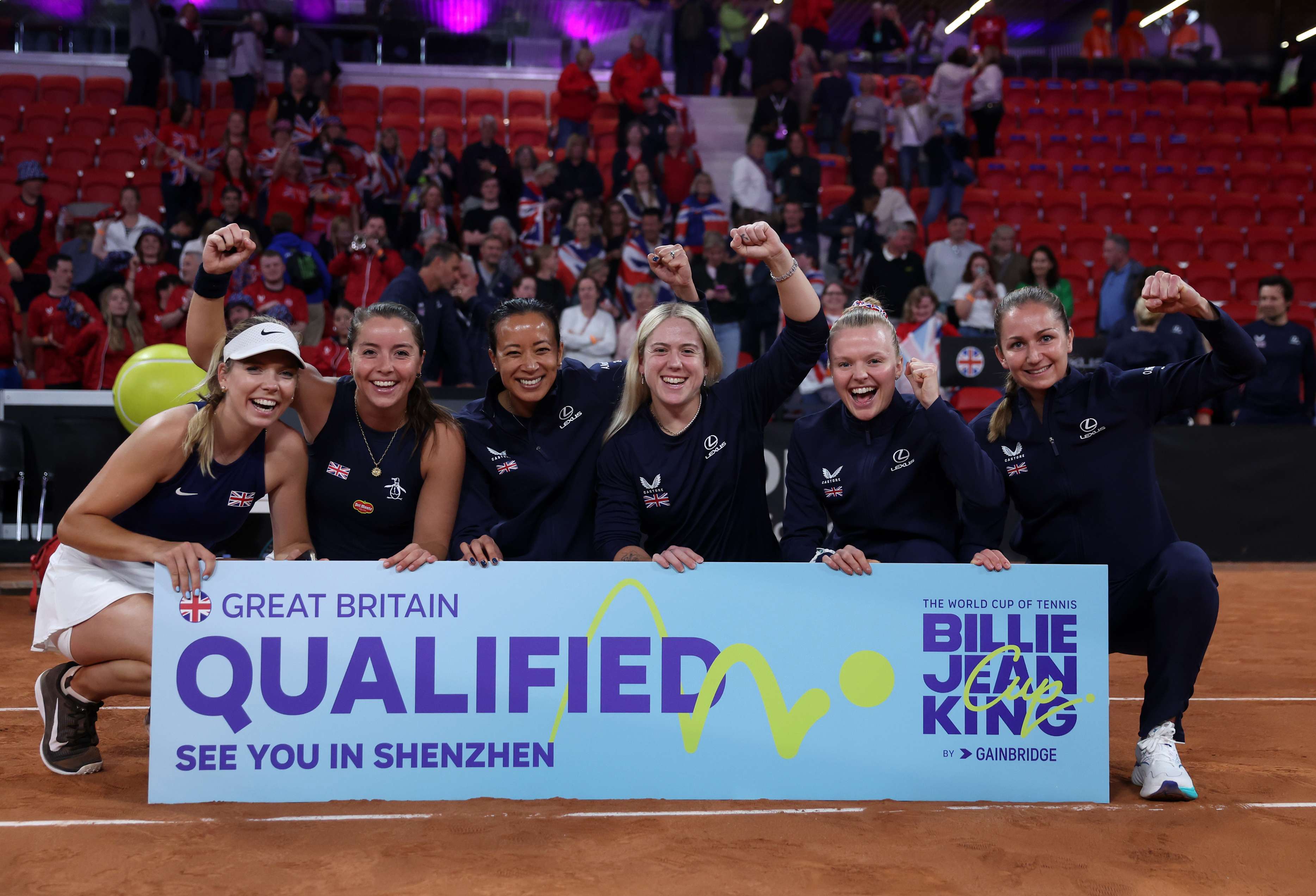 The Lexus GB Billie Jean King Cup team holding the qualified sign after beating Netherlands