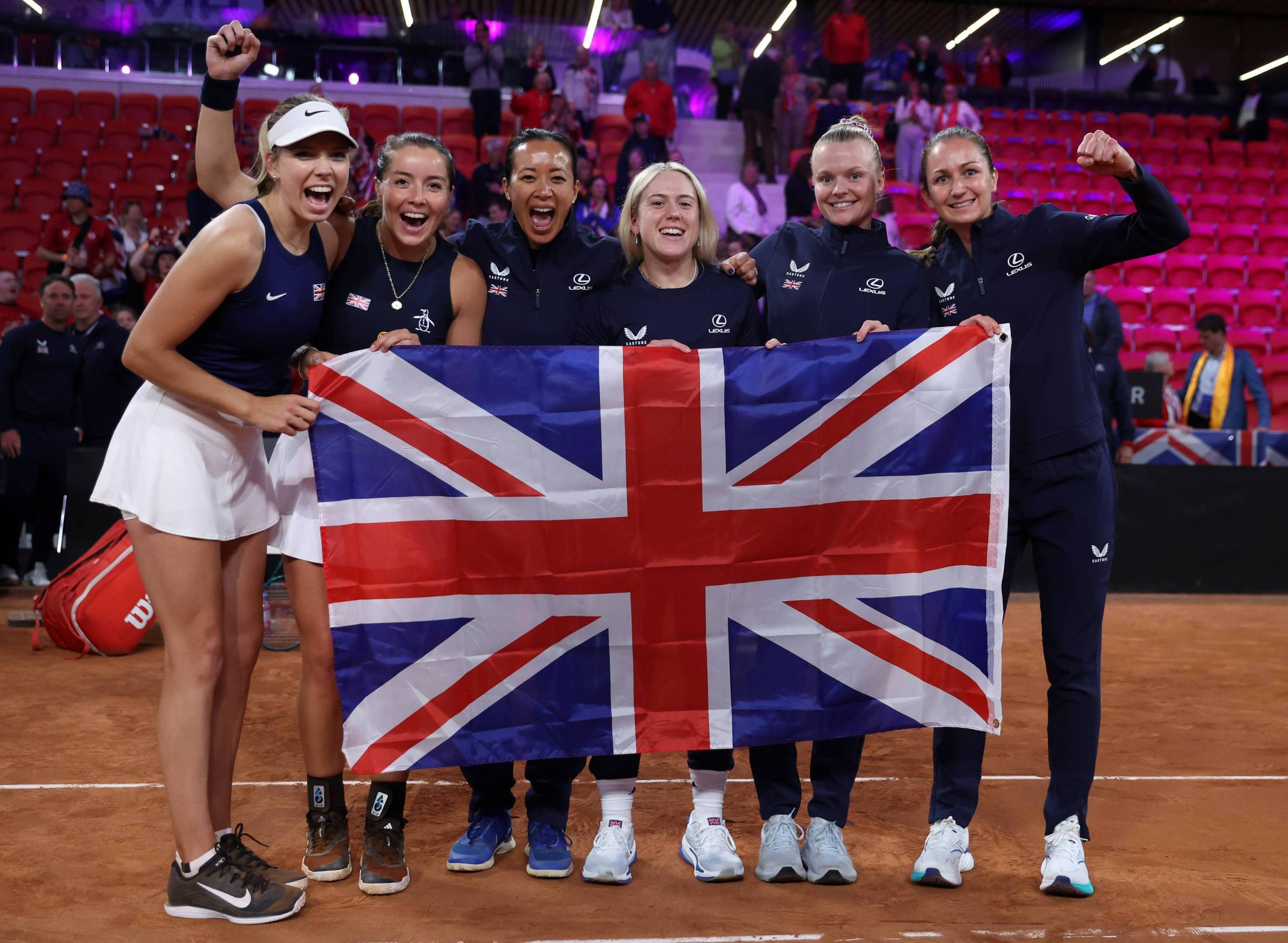 The Lexus GB Billie Jean King Cup team holding the British flag after coming through Qualifiers in The Hague