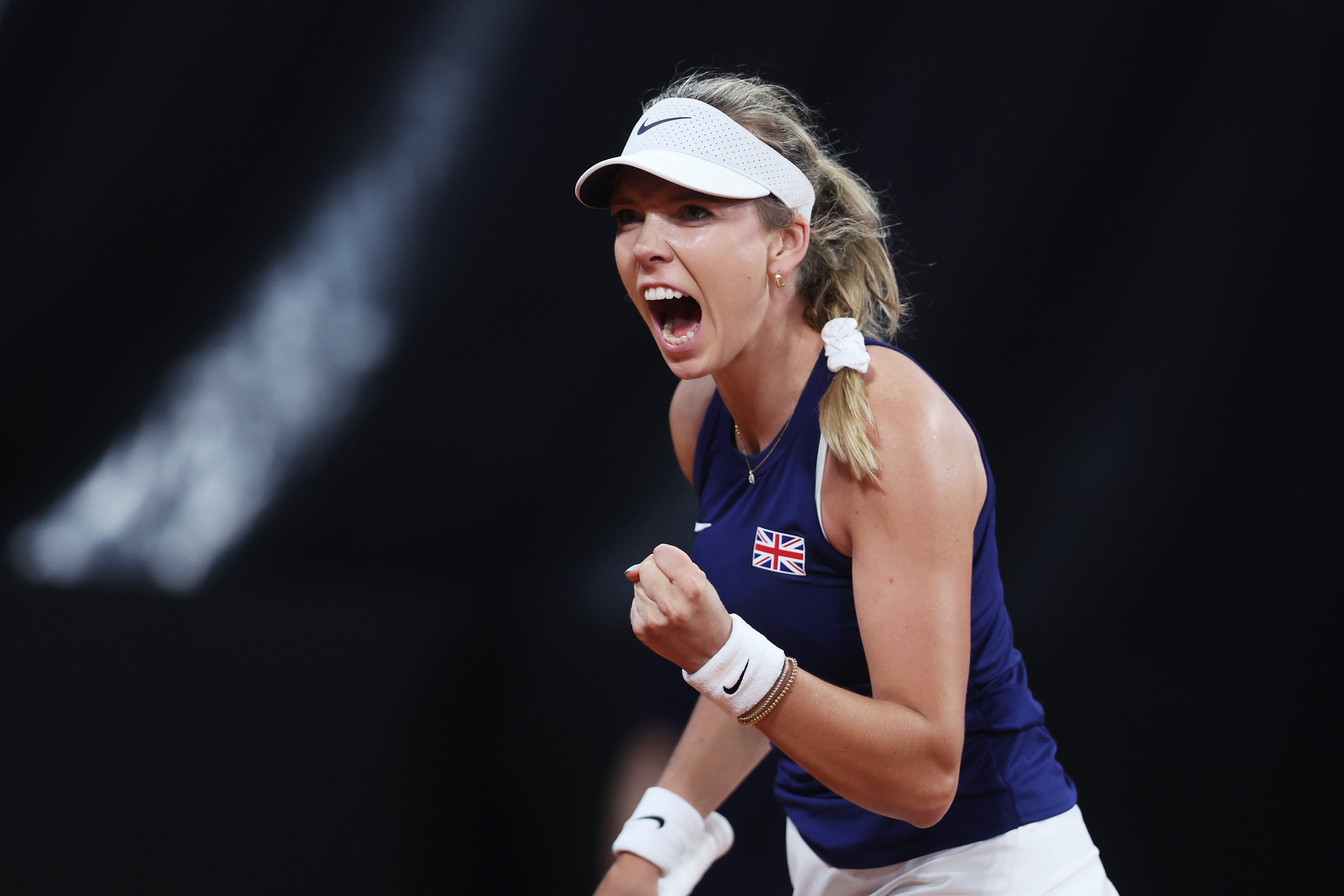 Katie Boulter roaring in celebration on court at the Billie Jean King Cup