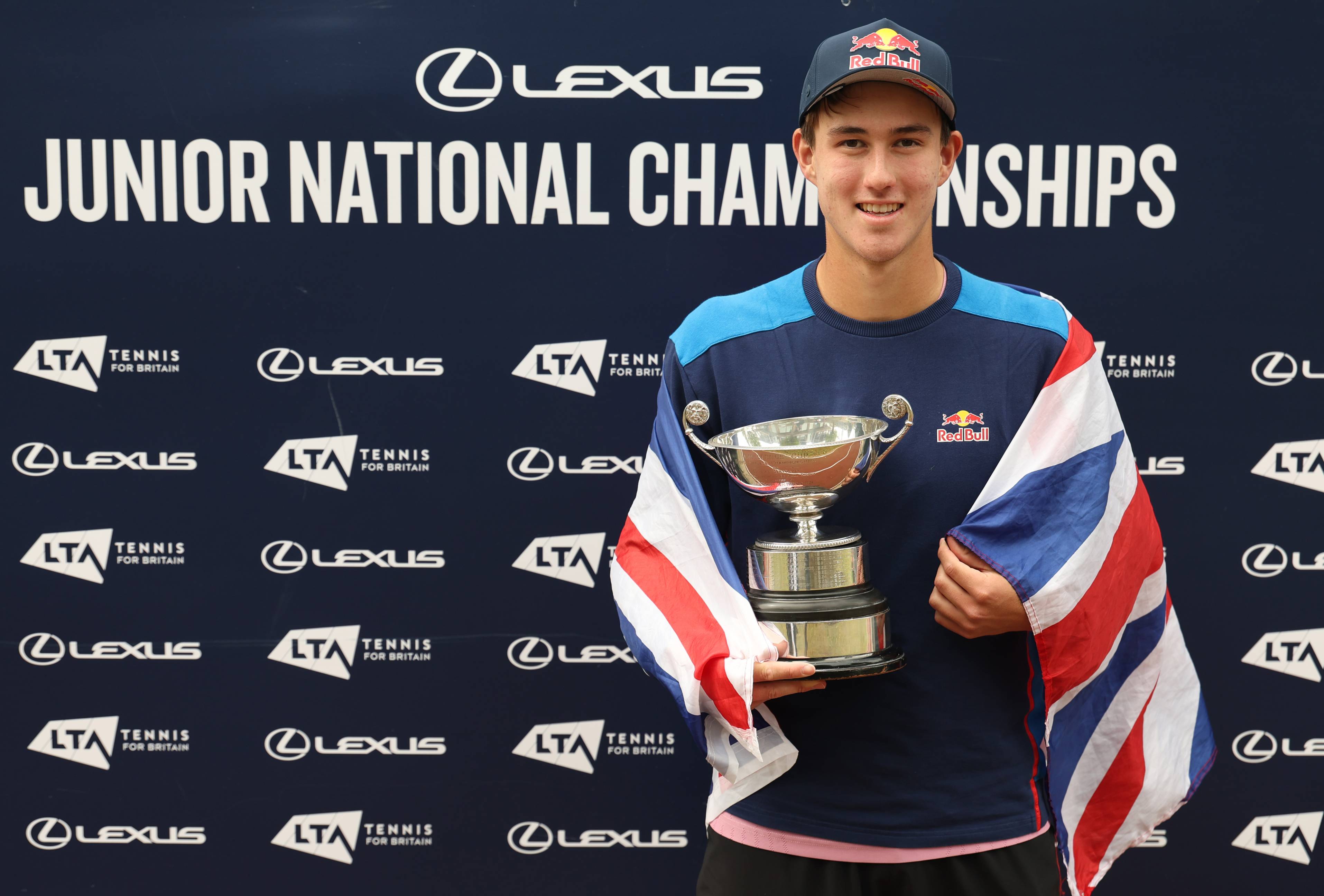 Oliver Bonding holding the 2025 18U Lexus Junior National Championships title
