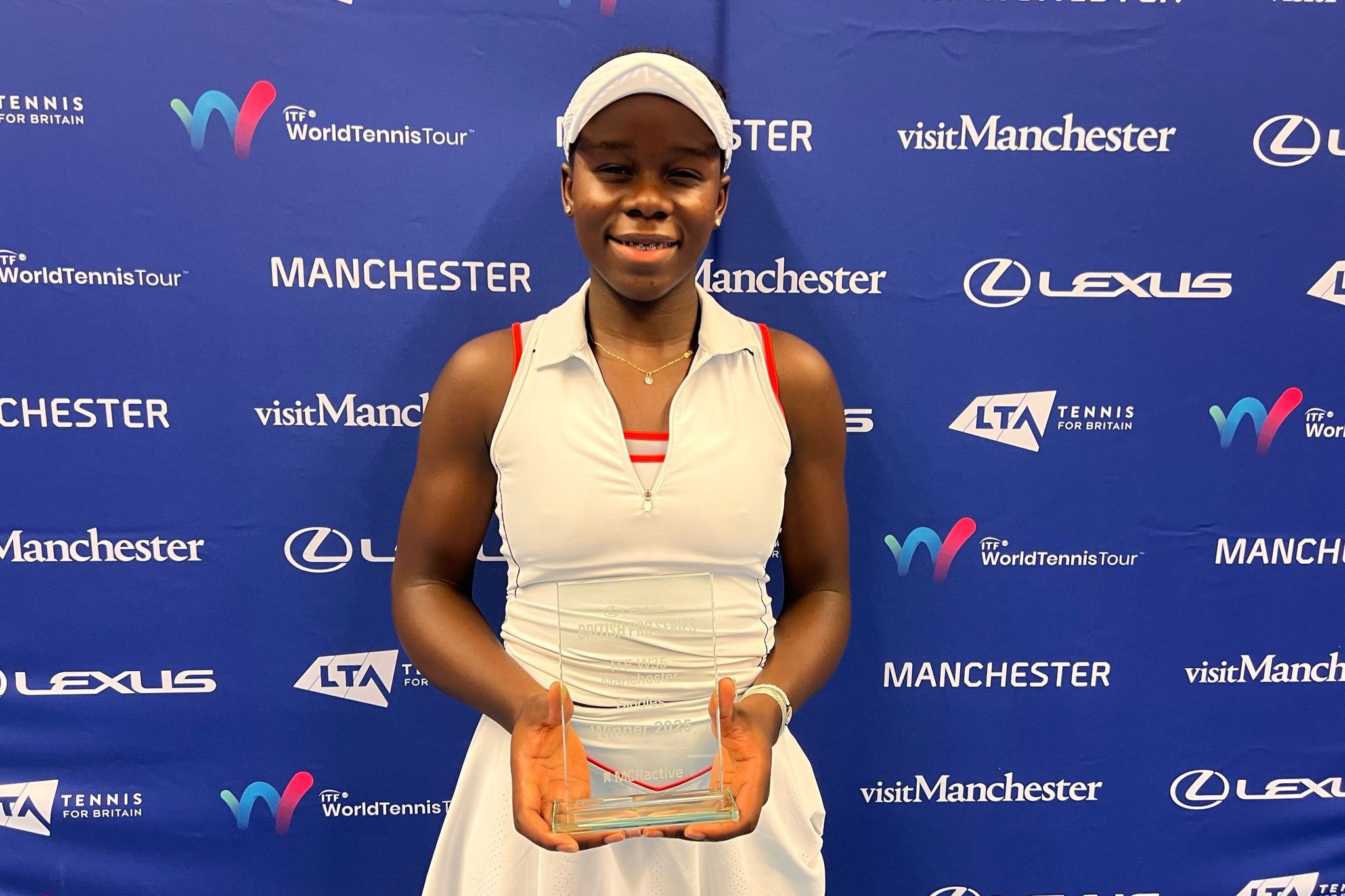 Victoria Mboku - singles champion at the Lexus GB Pro Series Manchester - holding her trophy after winning