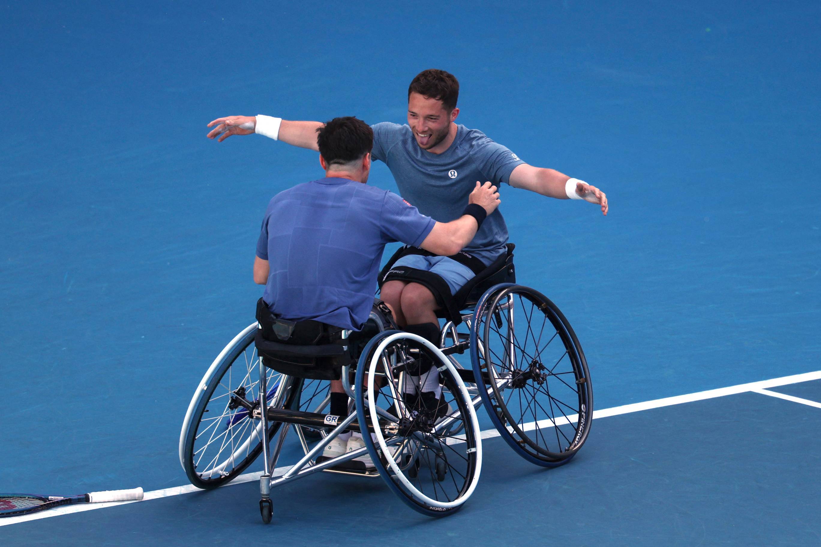 Alfie Hewett and Gordon Reid hug after wining their sixth successive Australian Open doubles title in 2025