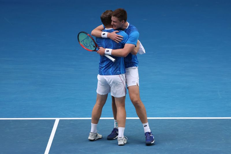 Henry Patten and Harri Heliovaara hug after winning in the Australian Open semi-final