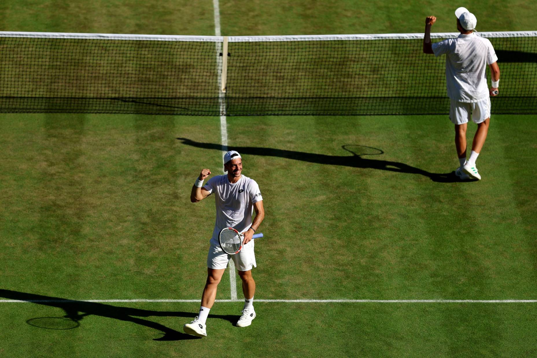 Julian Cash and Lloyd Glasspool celebrate reaching the final at Wimbledon 2025