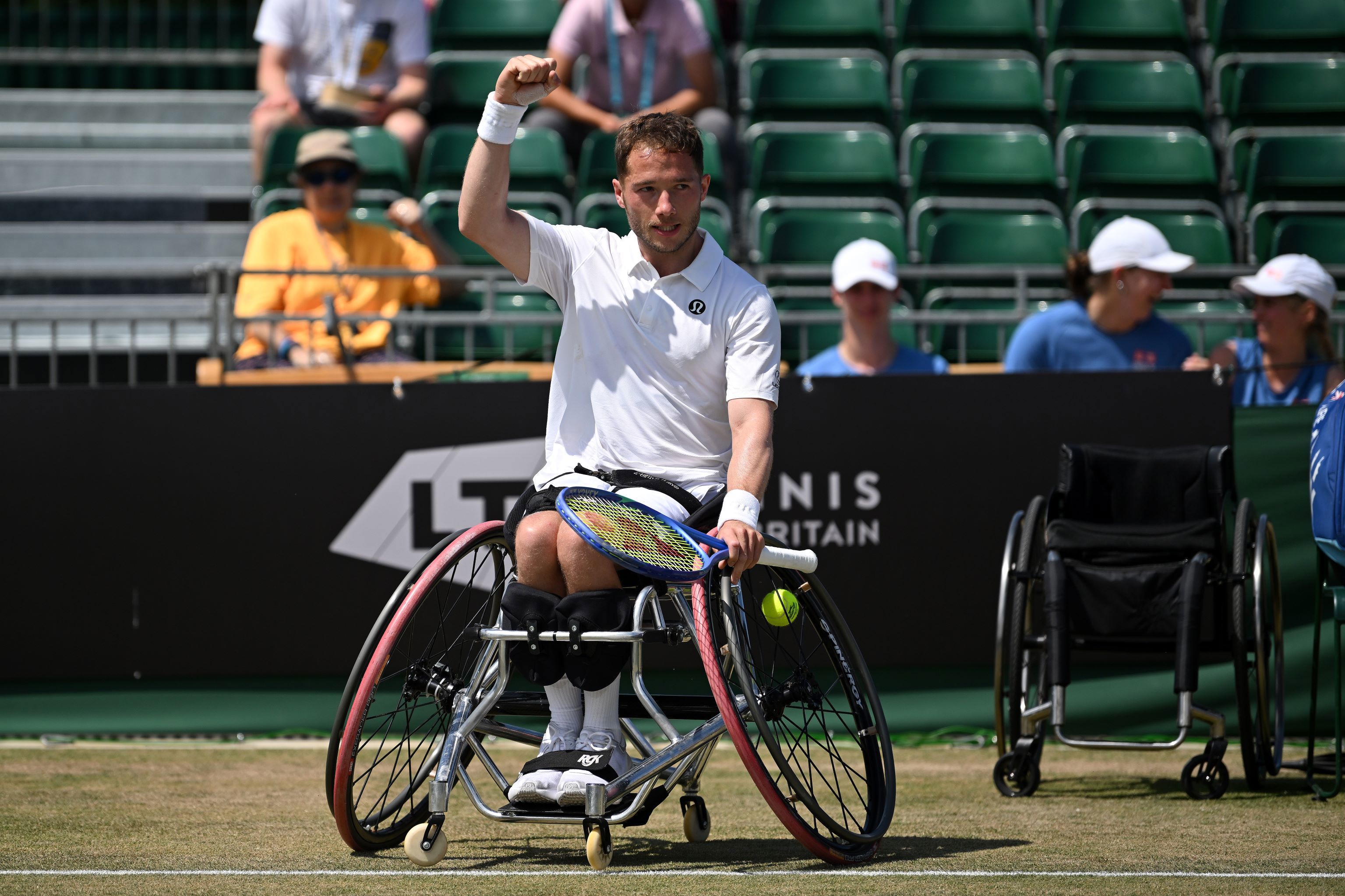 Alfie Hewett raises a fist in celebration after winning the Lexus British Open final