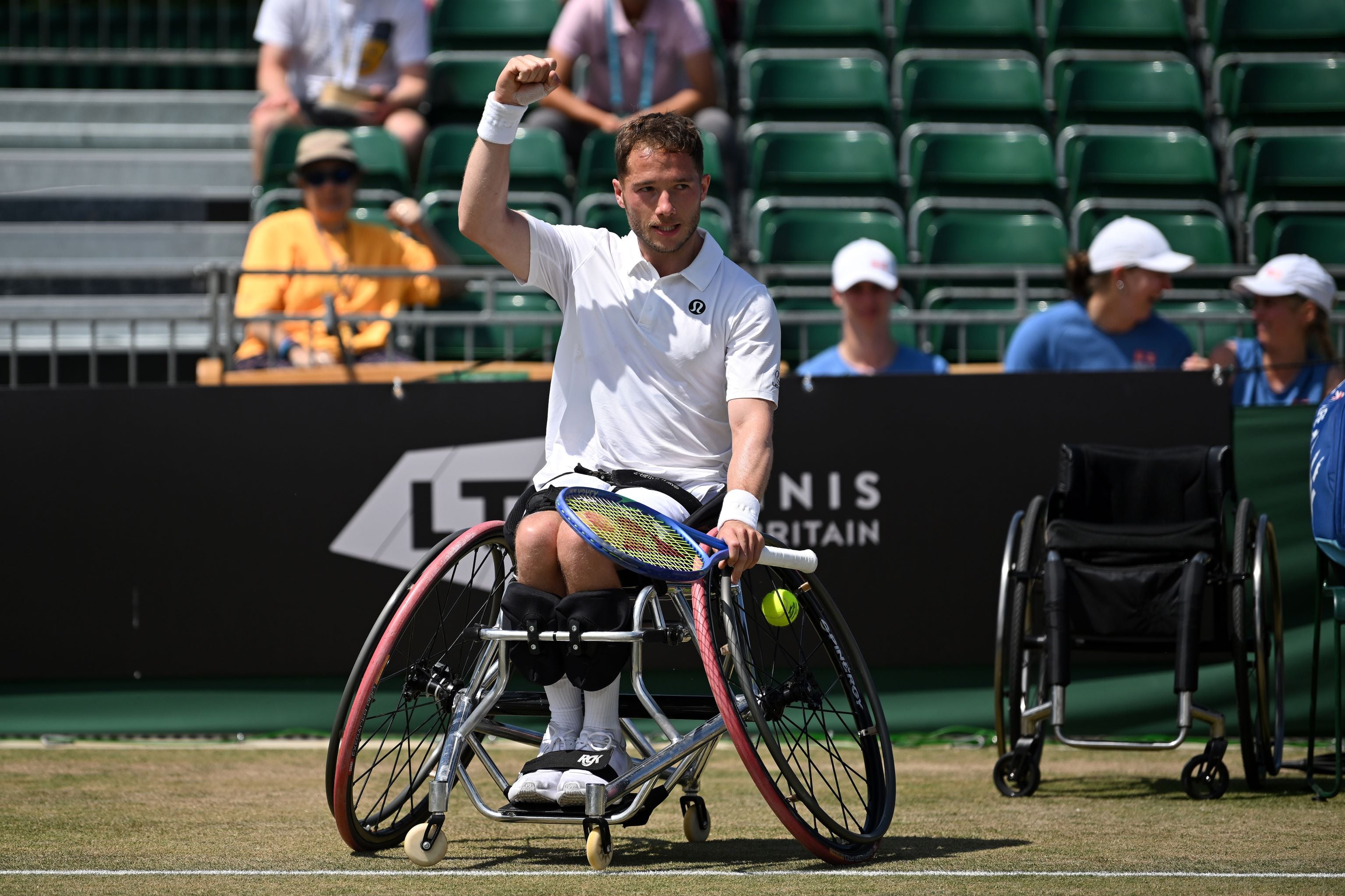 Alfie Hewett raises a fist in celebration after winning the Lexus British Open final
