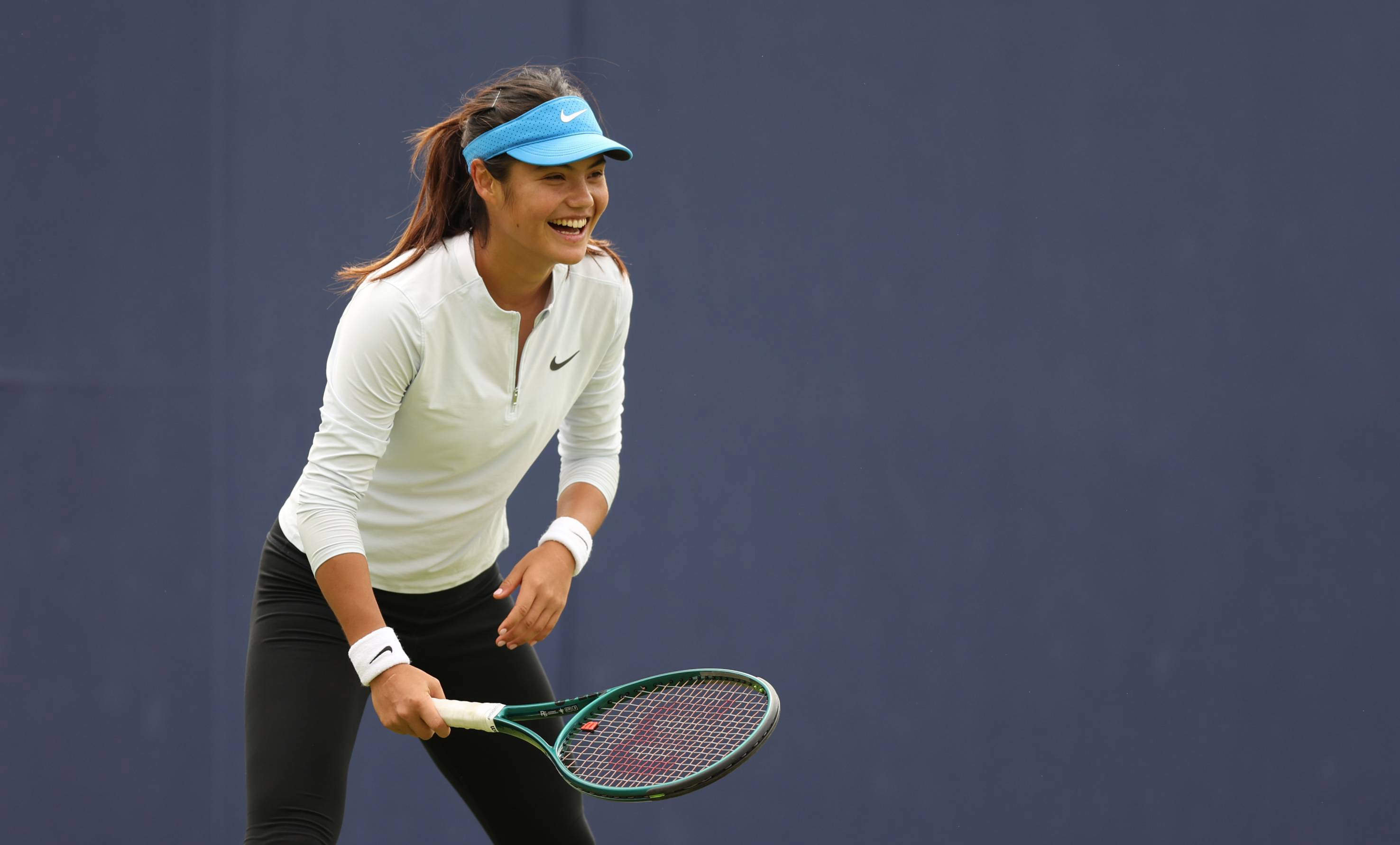 Emma Raducanu laughing while practicing at the HSBC Championships