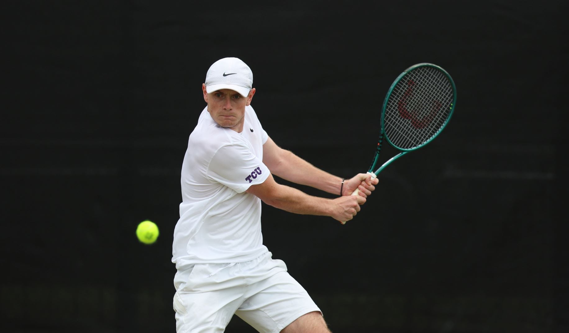Jack Pinnington Jones about to hit the ball with a backhand