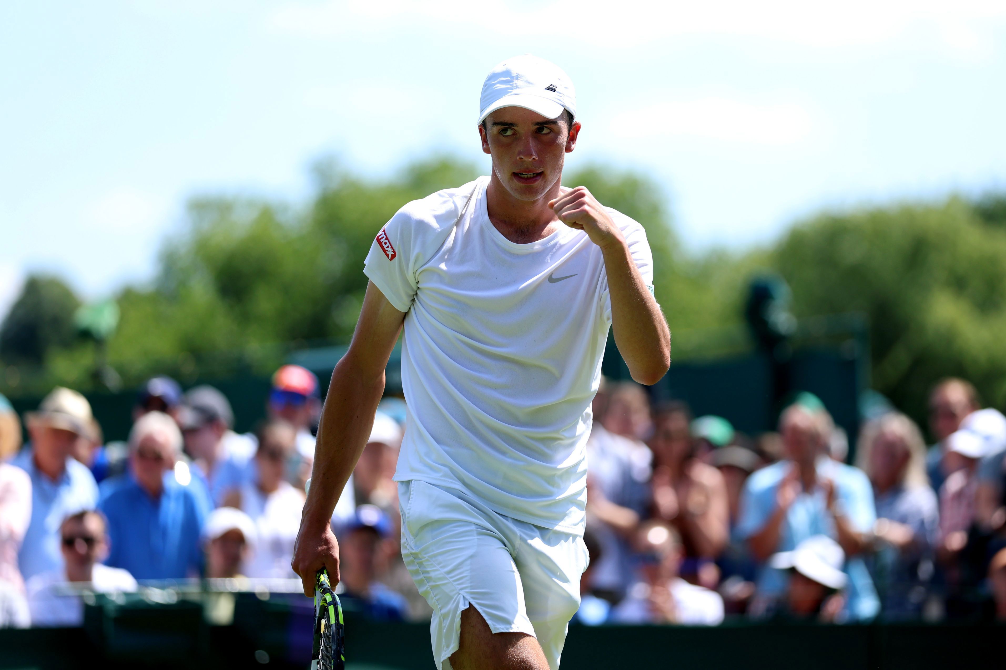 Oliver Tarvet pumps his fist during his first round win at Wimbledon 