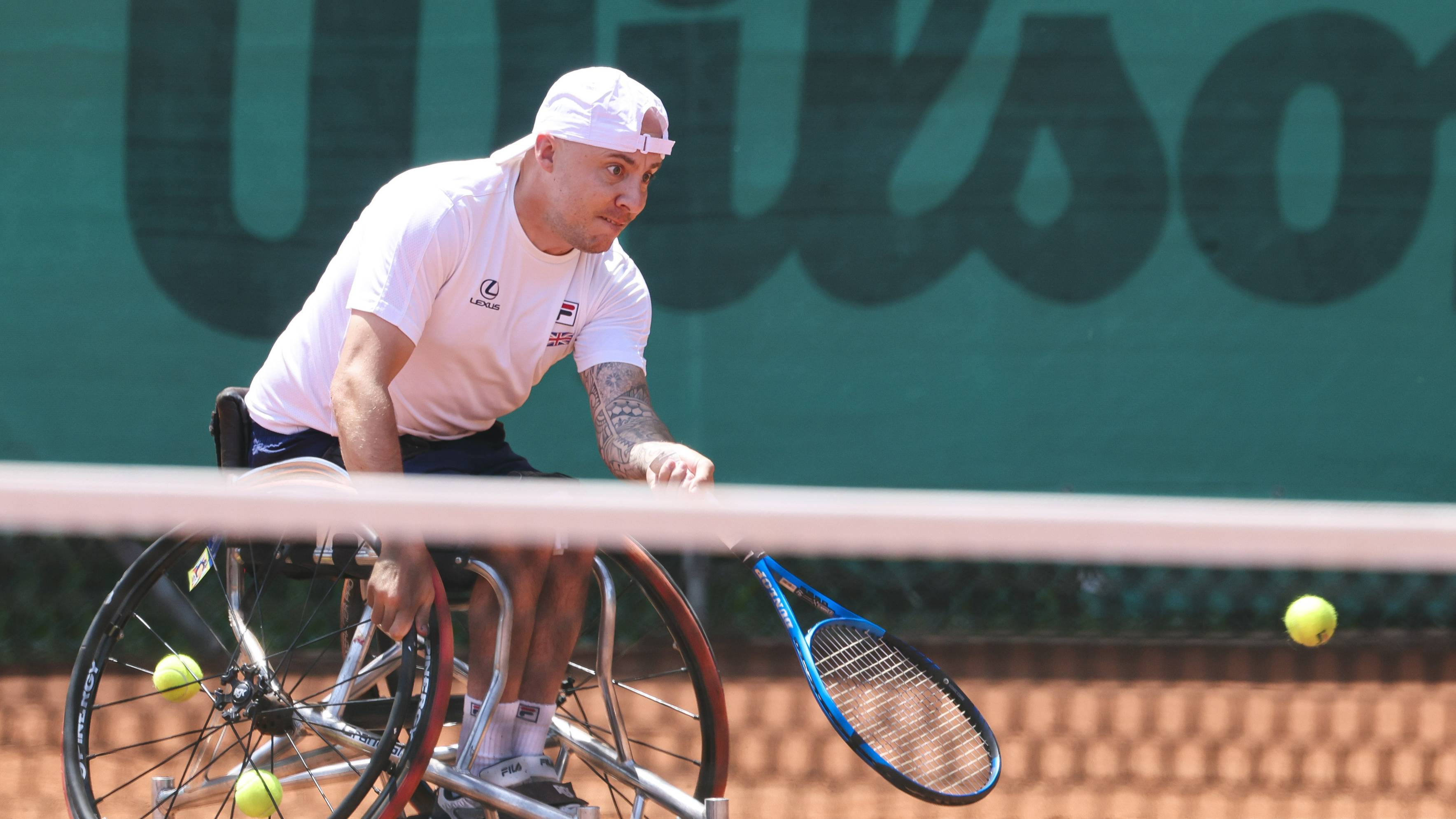 Andy Lapthorne reaches for a forehand for Great Britain at the 2025 World Team Cup