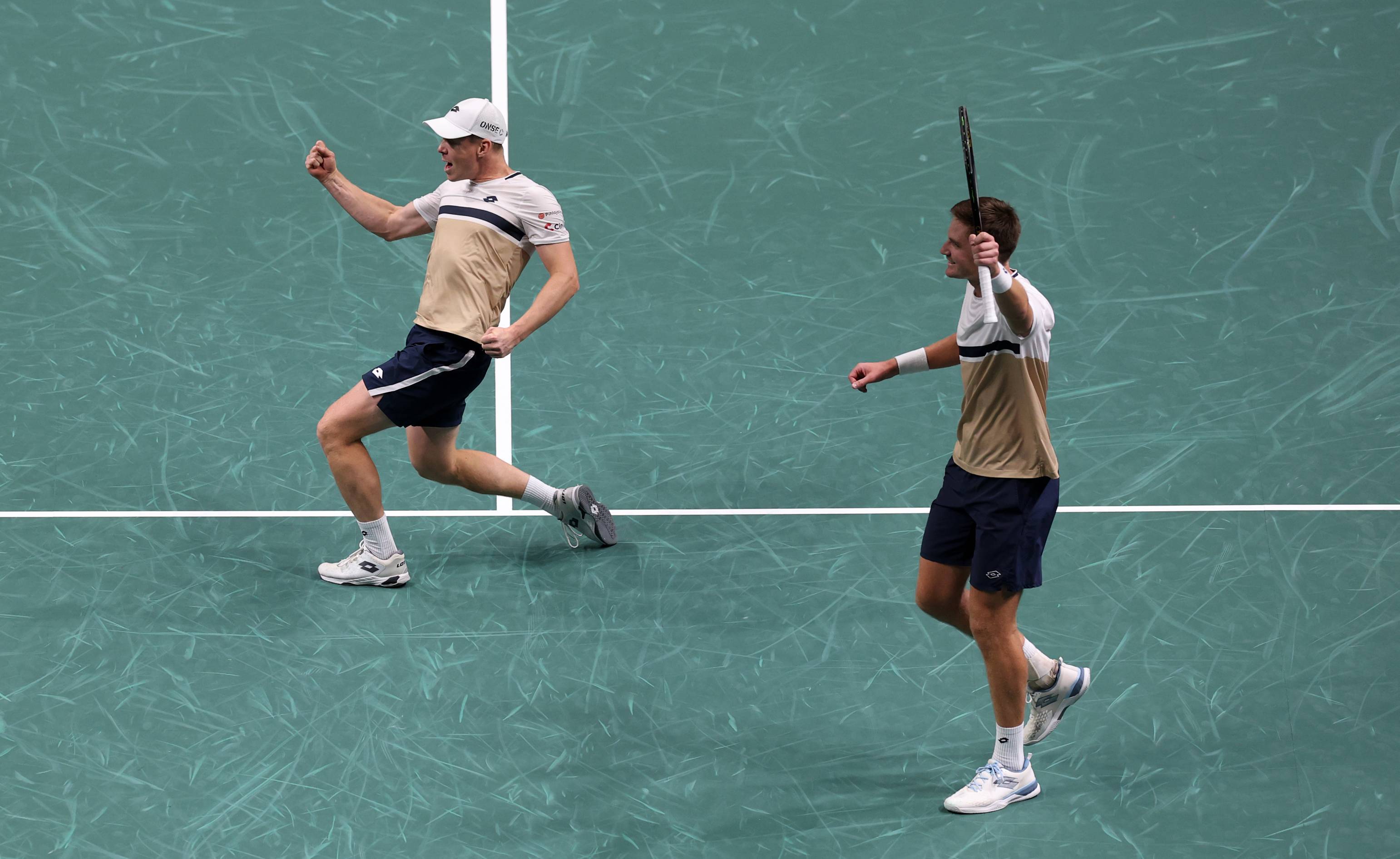 Harri Heliovaara and Henry Patten celebrate winning the Rolex Paris Masters title
