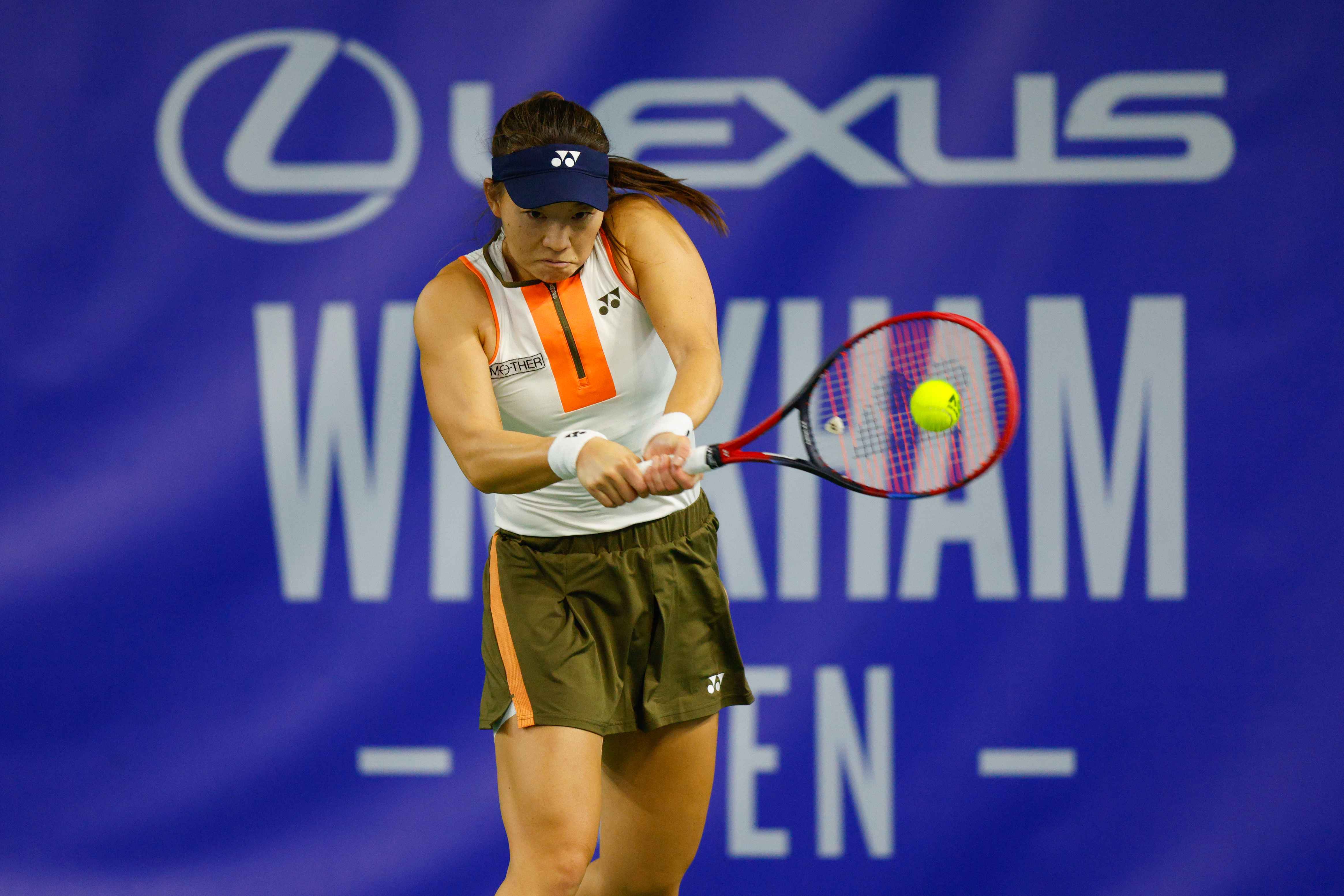 Lily Miyazaki hits a backhand at the Lexus Wrexham Open