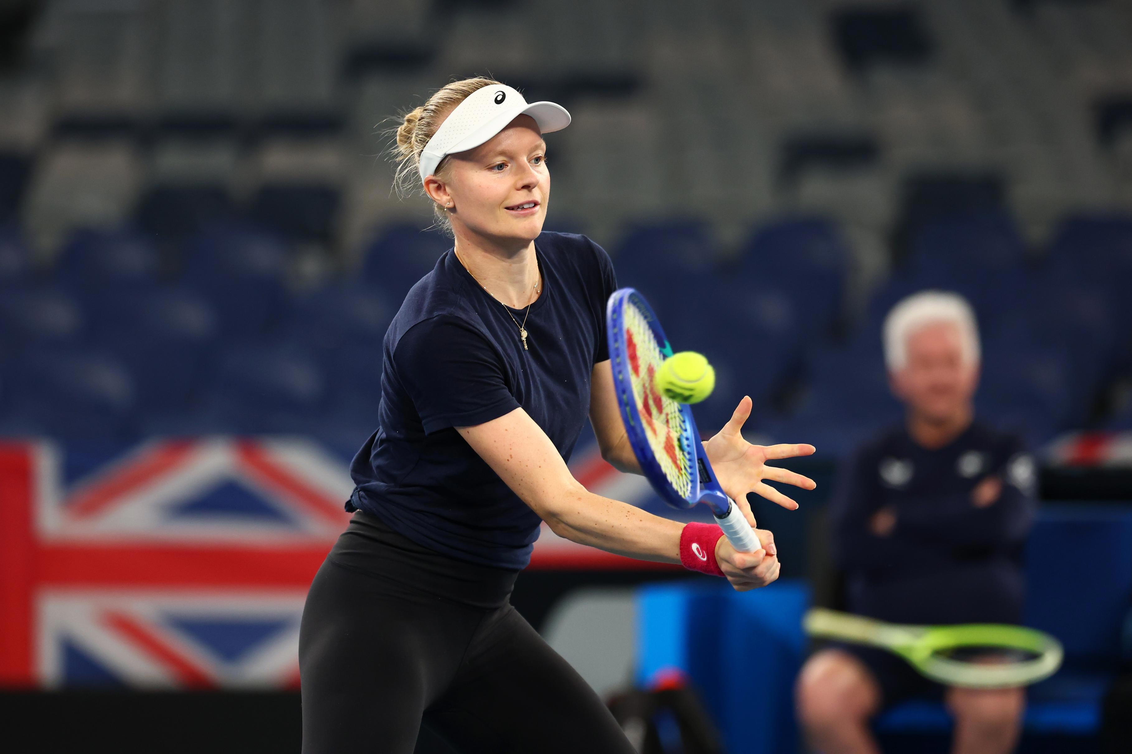 Harriet Dart hitting a volley on court at the Billie Jean King Cup qualifiers in Australia