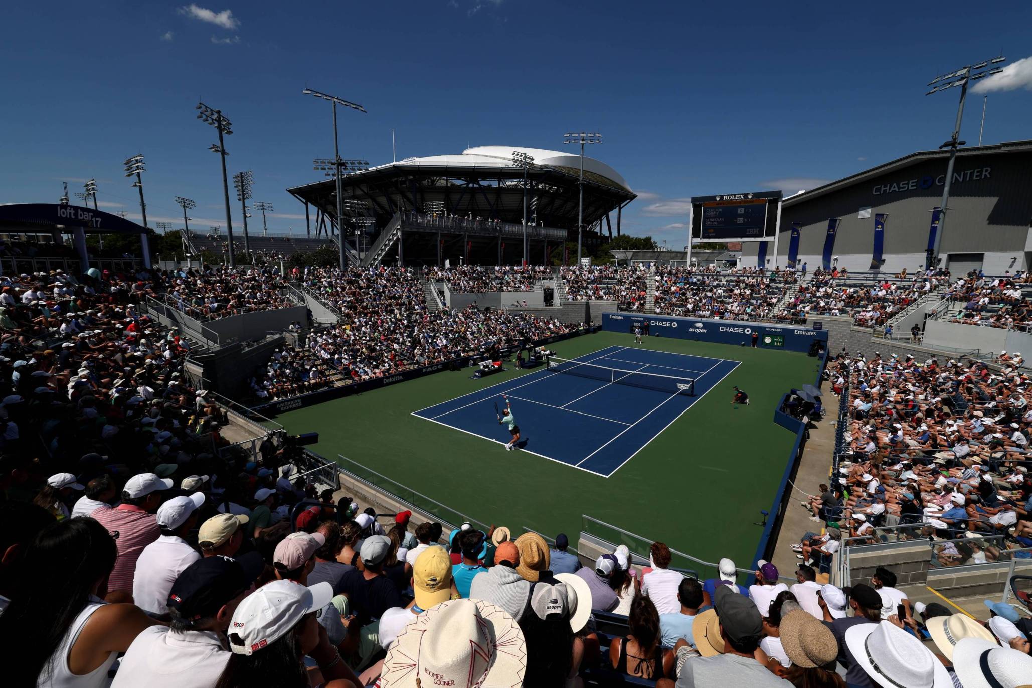 Crowd watching a match on the outdoor courts at the US Open