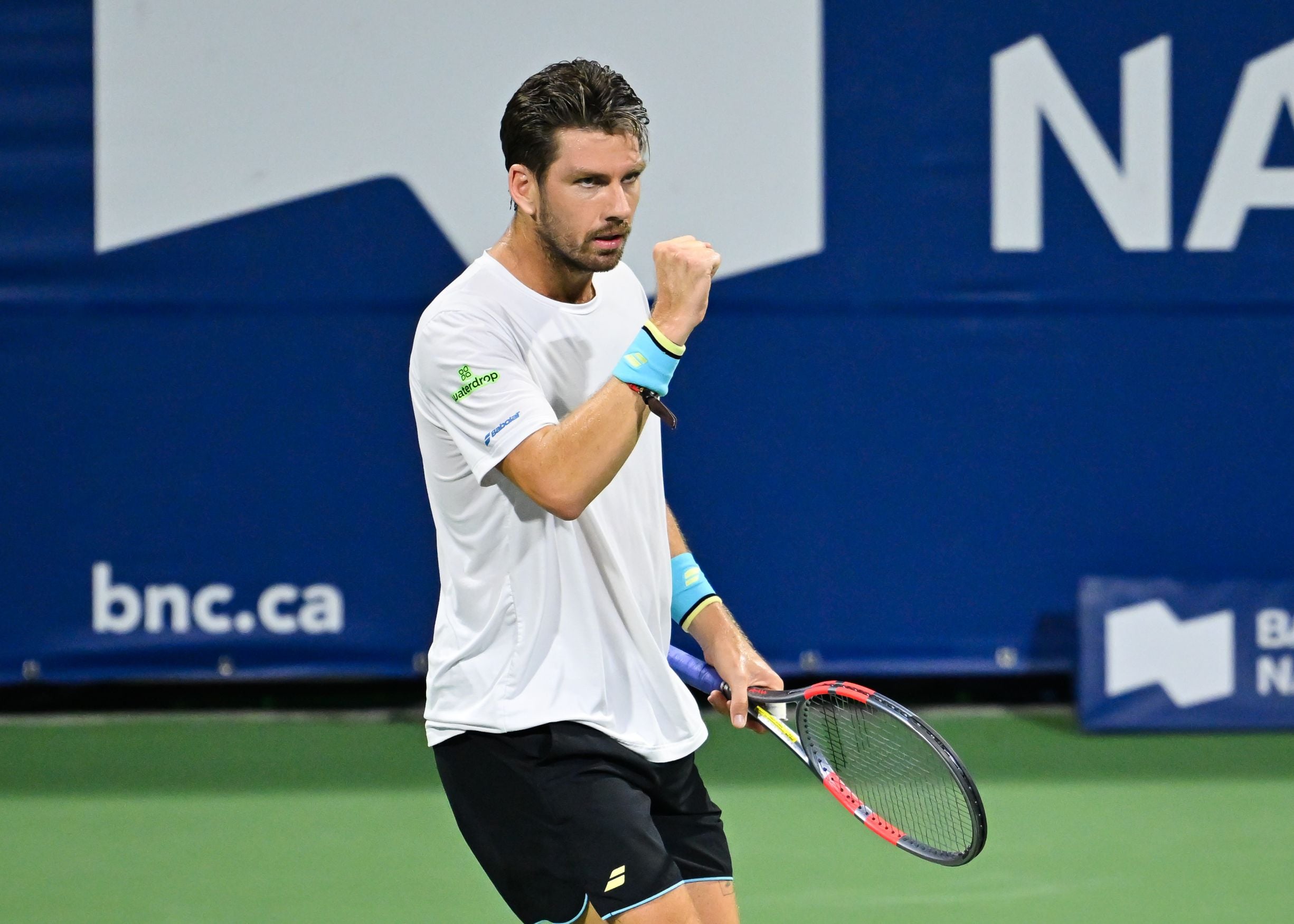 Cam Norrie gives a fist pump celebration after winning a point in the first round of the National Bank Open