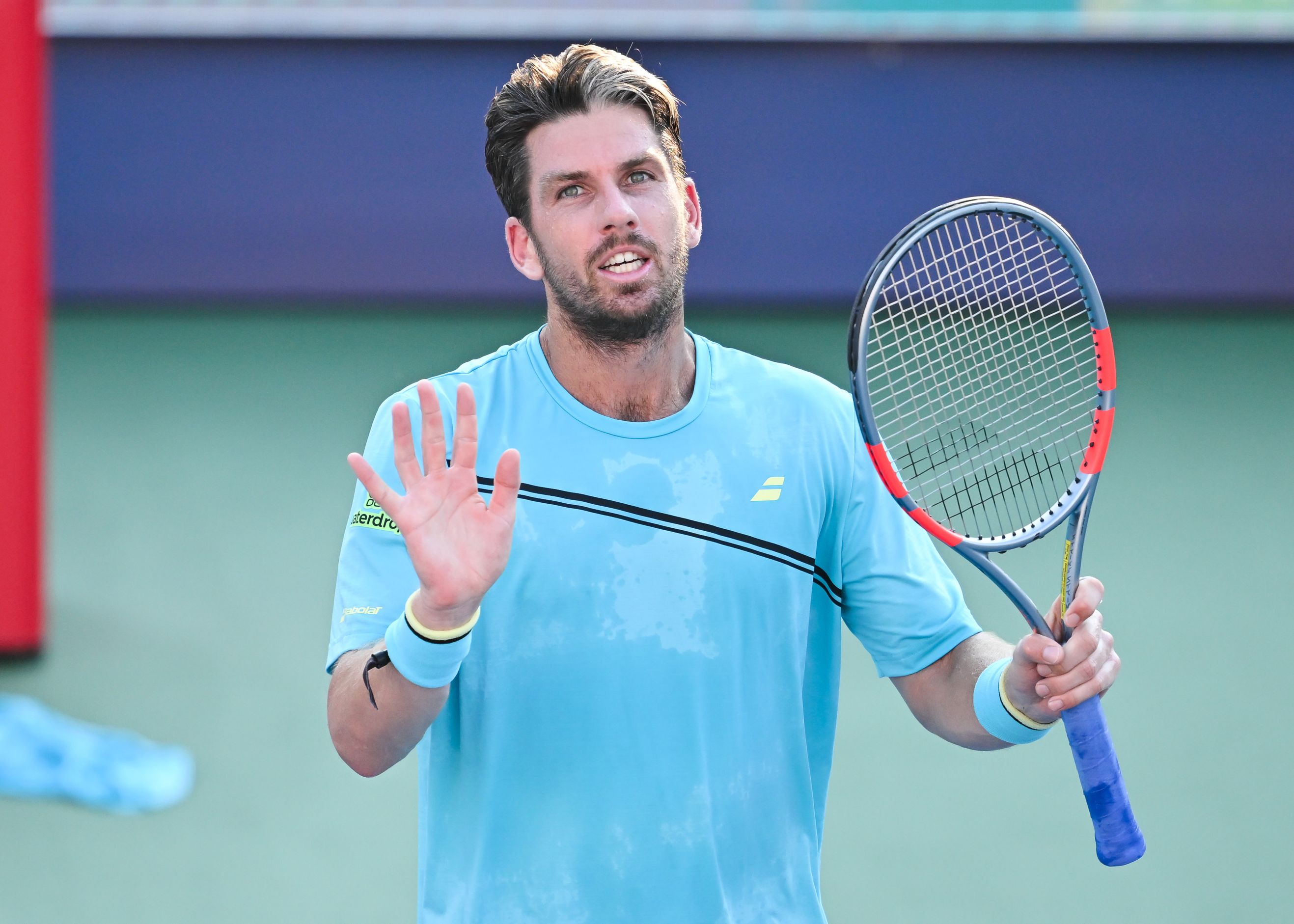 Cam Norrie waves to the crowd after reaching the fourth round of the National Bank Open