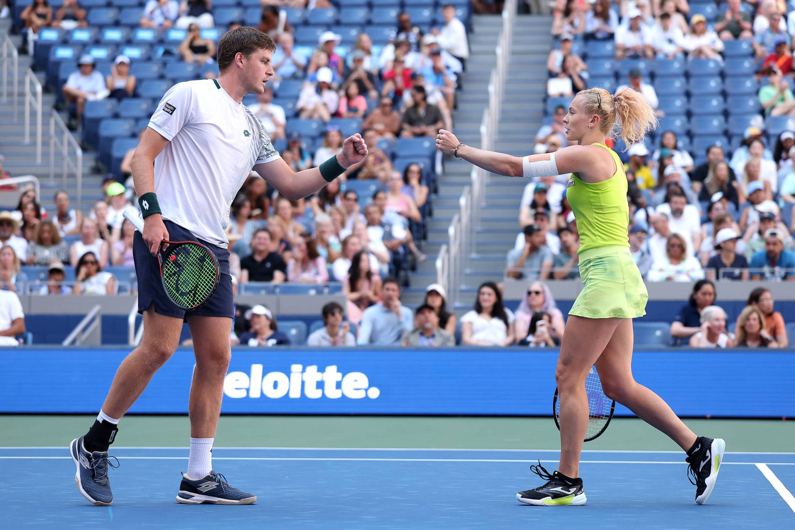 Henry Patten and Katerina Siniakova fist bump during the first round of the 2026 US Open mixed doubles