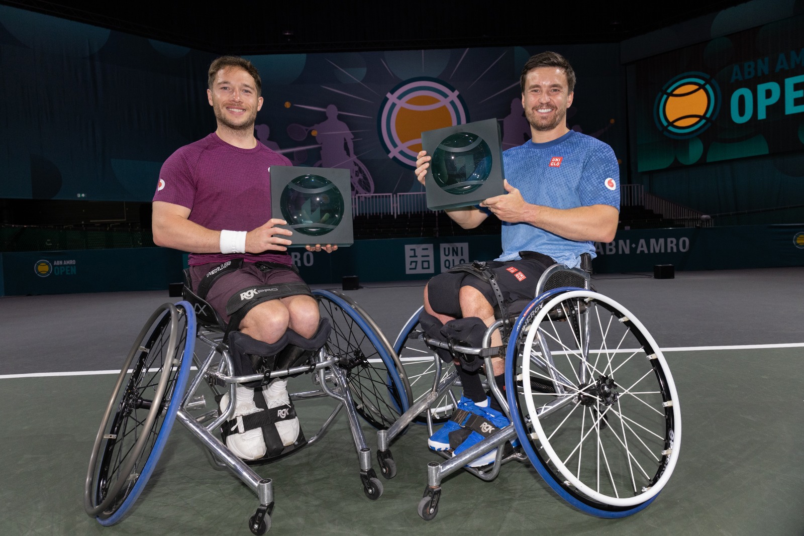 Alfie Hewett and Gordon Reid holding the Rotterdam title