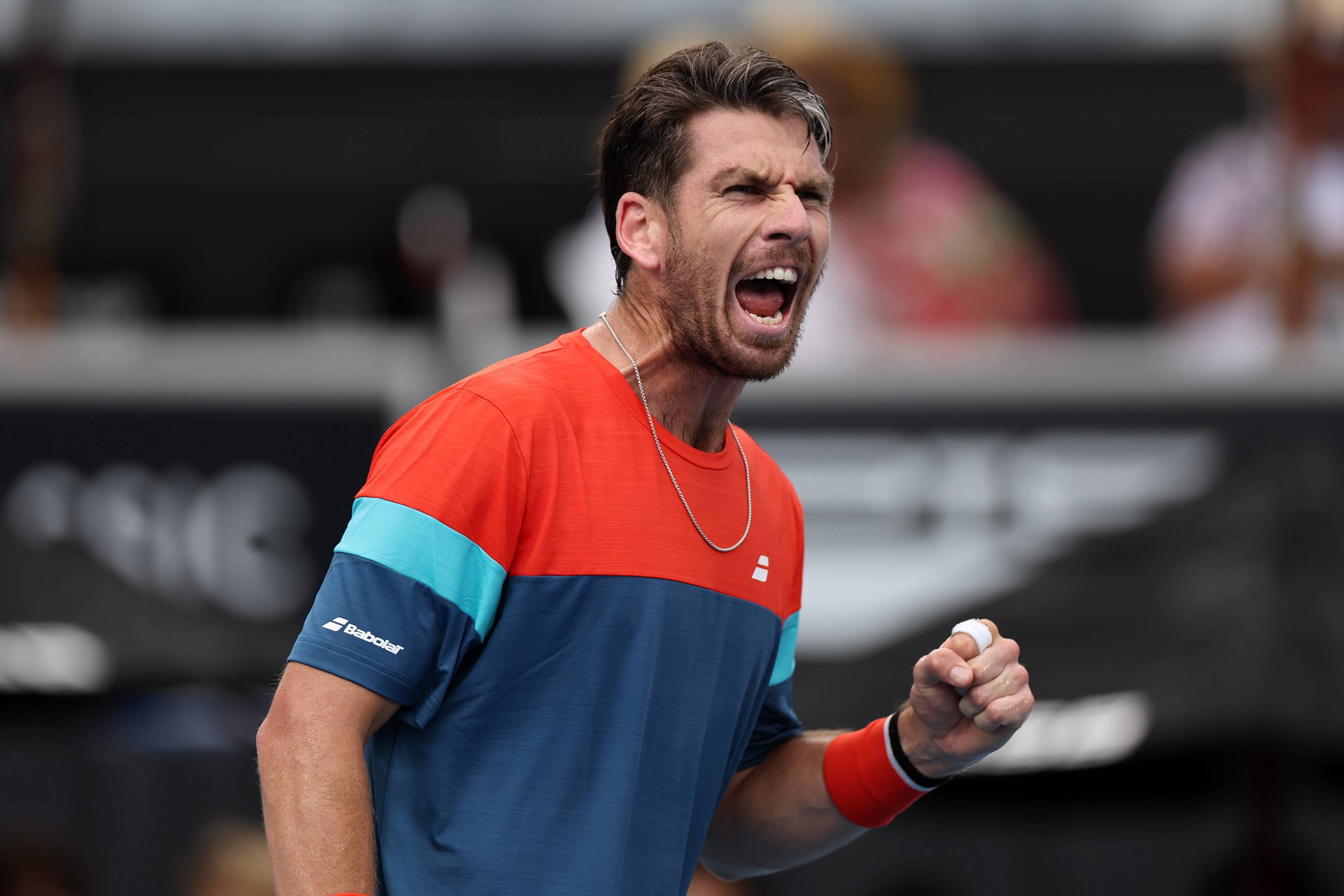 Cam Norrie roars in celebration after a win at the ASB Classic